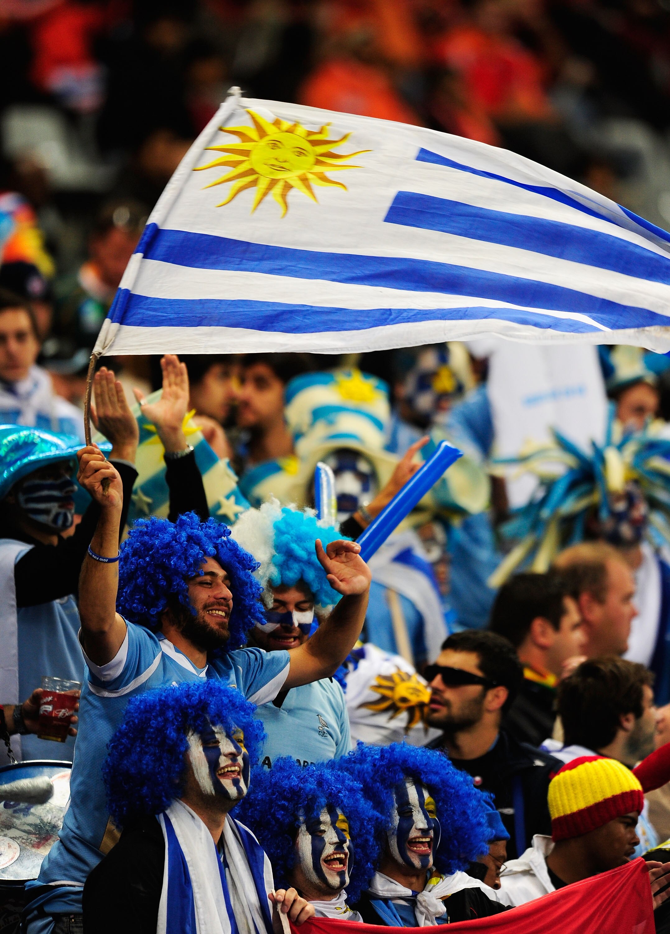 CAPE TOWN, SOUTH AFRICA - JULY 06:  Uruguay fans enjoy the atmosphere prior to the 2010 FIFA World Cup South Africa Semi Final match between Uruguay and the Netherlands at Green Point Stadium on July 6, 2010 in Cape Town, South Africa.  (Photo by Jamie Mc