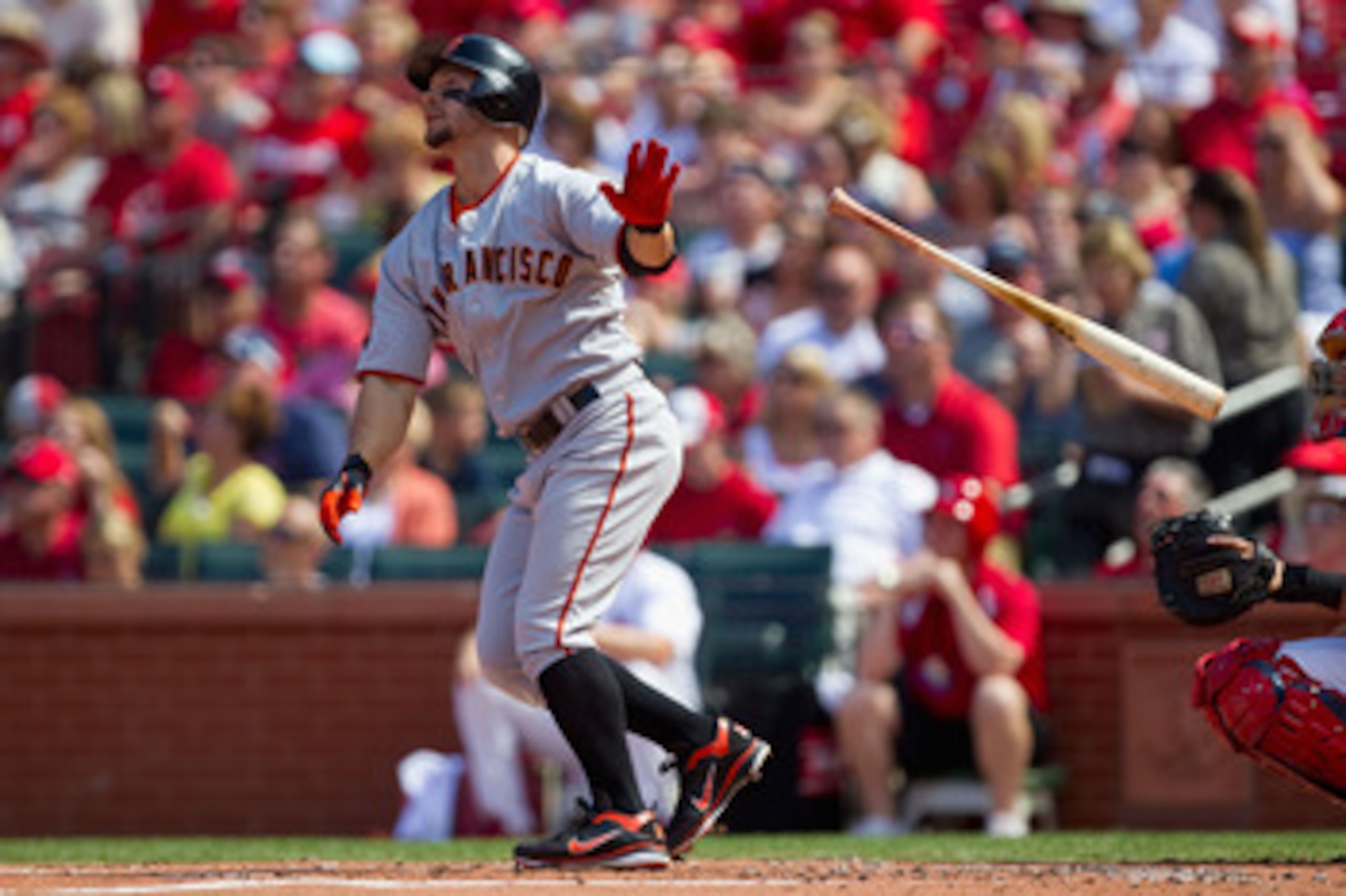 ST. LOUIS, MO - MAY 30:  Cody Ross #13 of the San Francisco Giants hits a solo home run against the St. Louis Cardinals at Busch Stadium on May 30, 2011 in St. Louis, Missouri.  (Photo by Dilip Vishwanat/Getty Images)