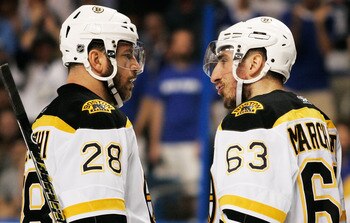 TAMPA, FL - MAY 21:  Mark Recchi #28 talks to Brad Marchand #63 of the Boston Bruins in Game Four of the Eastern Conference Finals against the Tampa Bay Lightning during the 2011 NHL Stanley Cup Playoffs at St Pete Times Forum on May 21, 2011 in Tampa, Fl