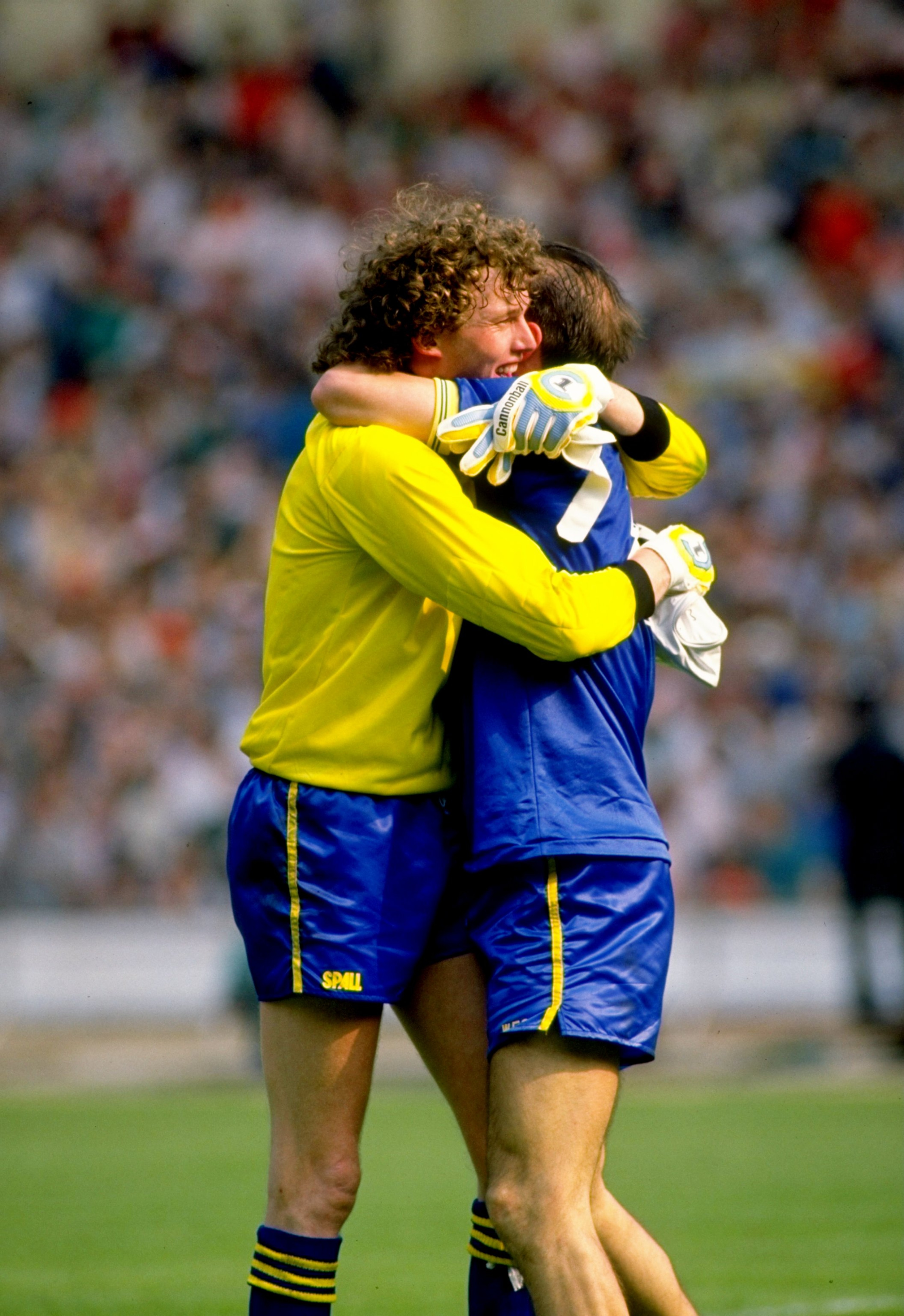 16 May 1988:  Wimbledon goalkeeper David Beasant and team mate Alan Cork celebrate after their victory in the FA Cup Final match against Liverpool played at Wembley Stadium in London, England.  Wimbledon won the match 1-0. \ Mandatory Credit: Allsport UK/