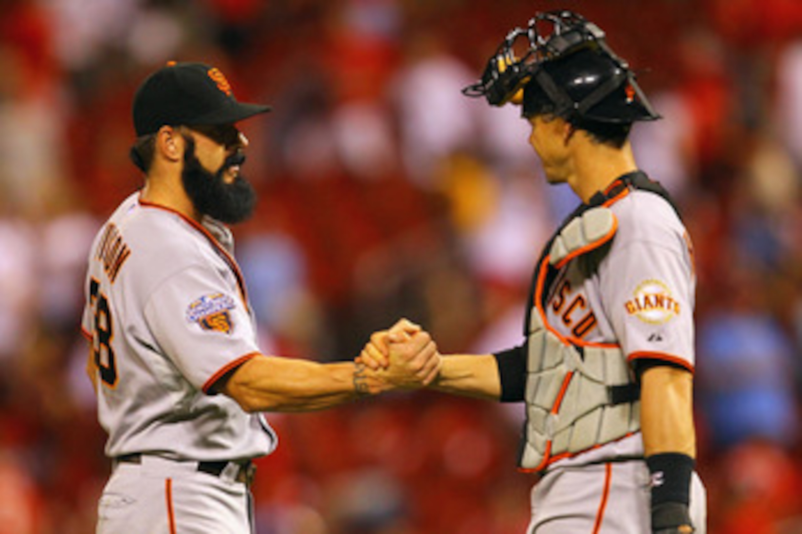 ST. LOUIS, MO - JUNE 1: Brian Wilson #38 and Eli Whiteside #22 of the San Francisco Giants congratulate each other after beating the St. Louis Cardinals in 11 innings at Busch Stadium on June 1, 2011 in St. Louis, Missouri.  (Photo by Dilip Vishwanat/Gett