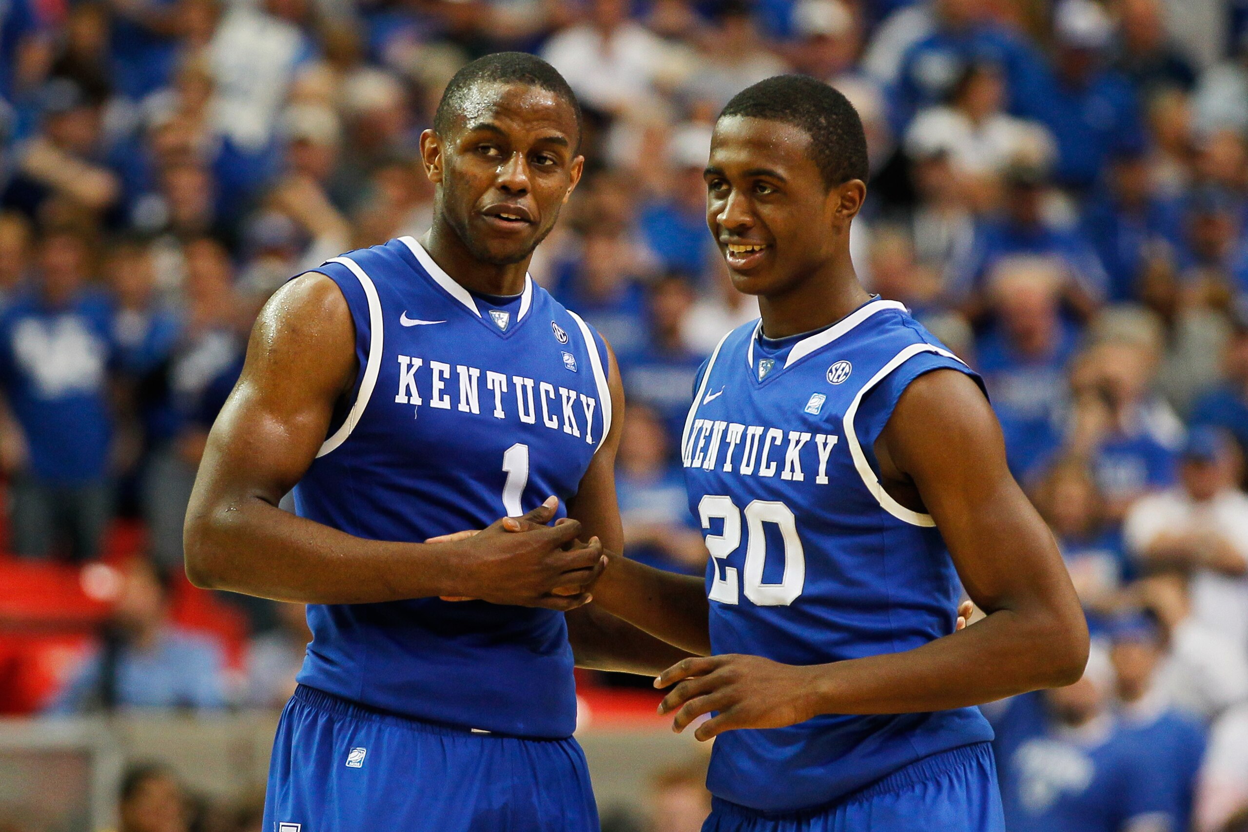 ATLANTA, GA - MARCH 13:  Darius Miller #1 and Doron Lamb #20 of the Kentucky Wildcats celebrate during their 70 to 54 win over the Florida Gators in the championship game of the SEC Men's Basketball Tournament at Georgia Dome on March 13, 2011 in Atlanta,