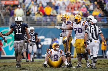 ORLANDO, FL - JANUARY 1: Jordan Jefferson #9 of the LSU Tigers lobbies for a late hit after being hit by Navorro Bowman #11 of the Penn State Nittany Lions during the 2010 Capital One Bowl at the Florida Citrus Bowl Stadium on January 1, 2010 in Orlando,