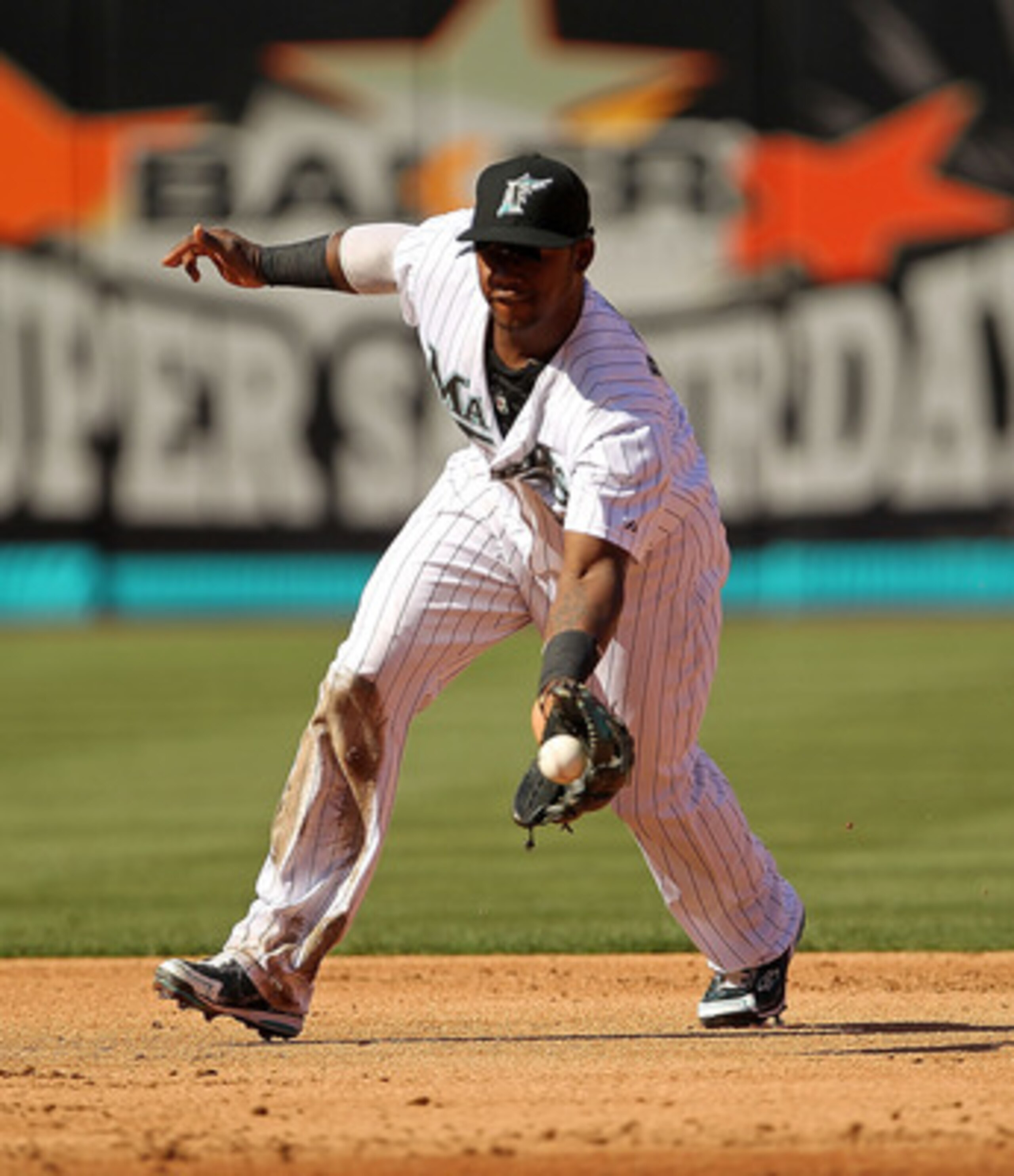 MIAMI GARDENS, FL - MAY 21: Hanley Ramirez #2 of the Florida Marlins fields a ground ball during a game against the Tampa Bay Rays at Sun Life Stadium on May 21, 2011 in Miami Gardens, Florida. (Photo by Mike Ehrmann/Getty Images)