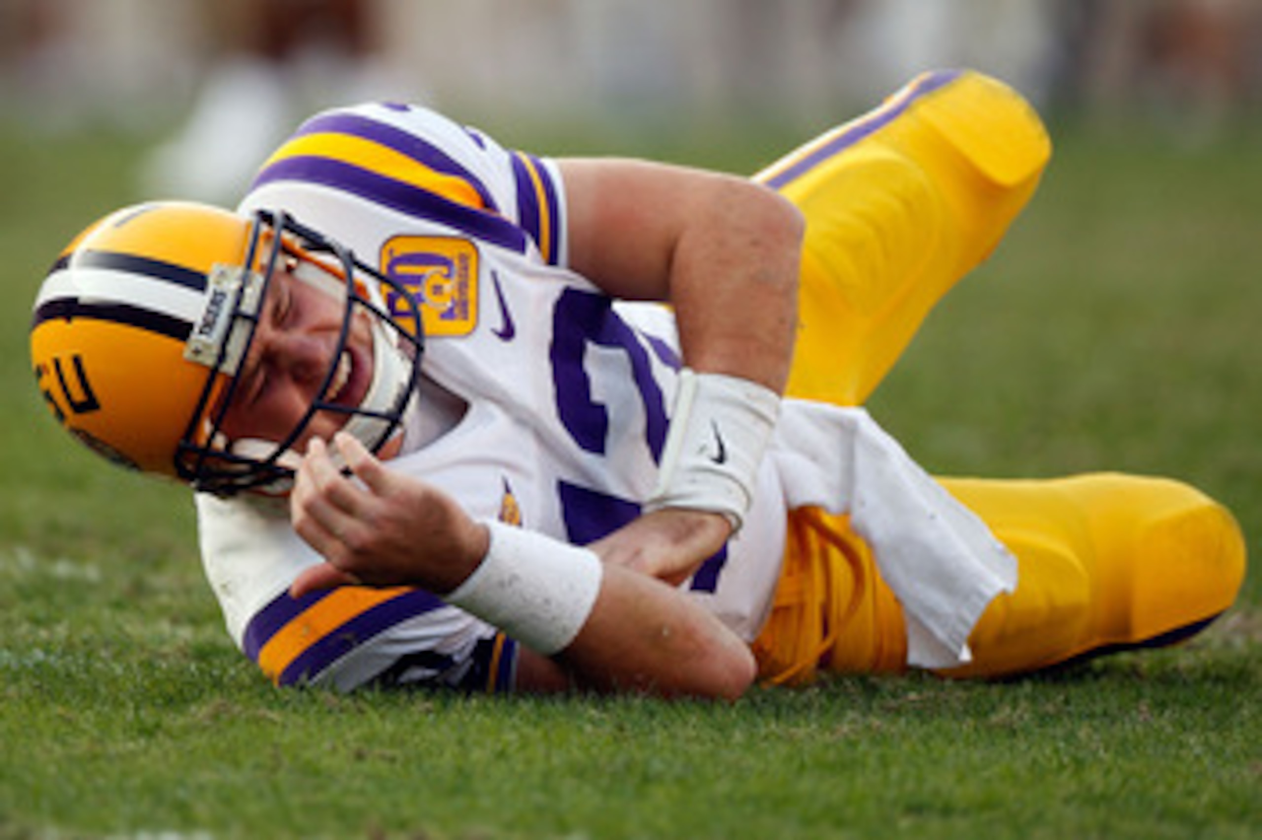 BATON ROUGE, LA - NOVEMBER 22:  Quarterback Jarrett Lee #12 of the Louisiana State University Tigers lies on the ground after suffering an injury while playing the Ole Miss Rebels on November 22, 2008 at Tiger Stadium in Baton Rouge, Louisiana. Lee did no