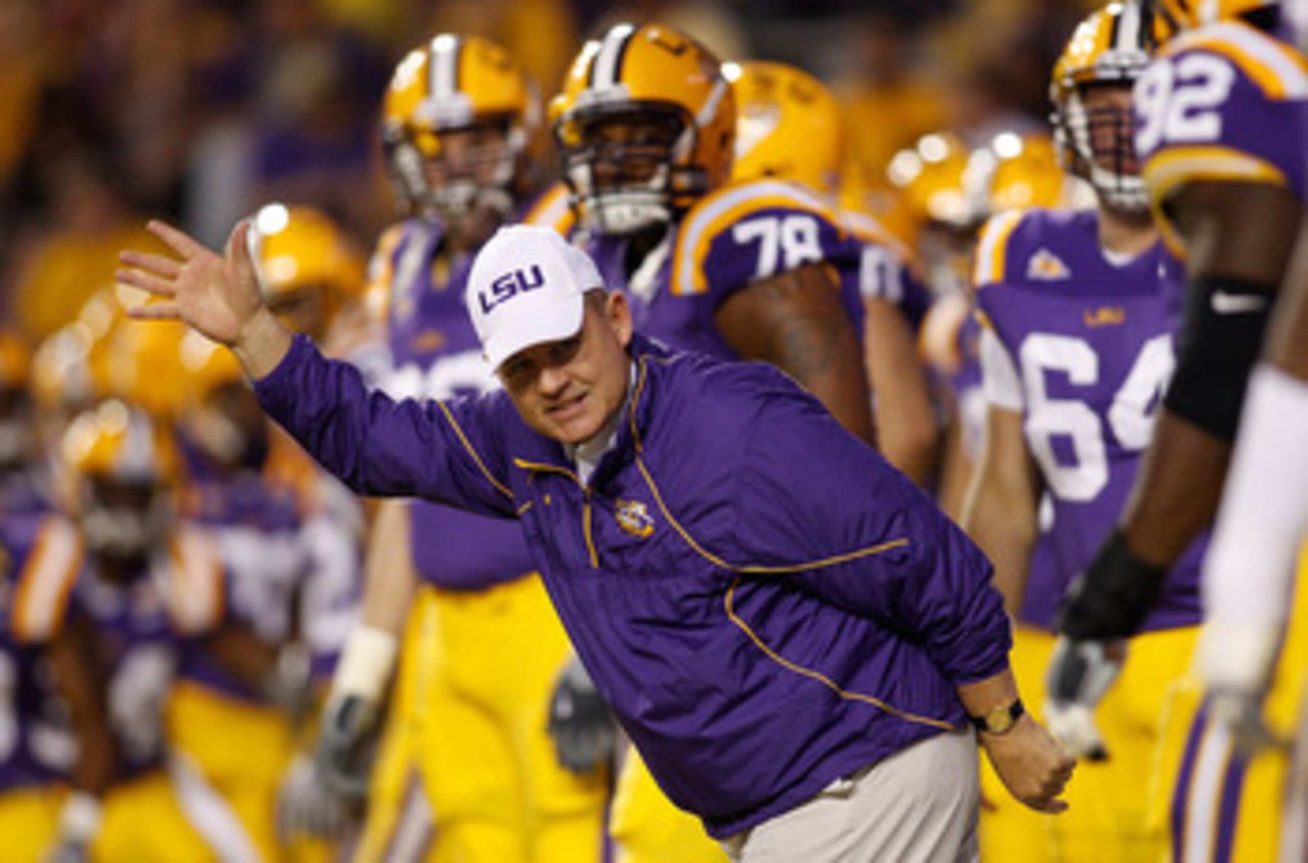 BATON ROUGE, LA - NOVEMBER 13:  Head coach Les Miles of the Louisiana State University Tigers runs on to the field during pregame before playing the  Louisiana Monroe Warhawks at Tiger Stadium on November 13, 2010 in Baton Rouge, Louisiana.  (Photo by Chr