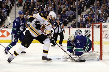 VANCOUVER, BC - JUNE 01:  Zdeno Chara #33 of the Boston Bruins takes a shot against Roberto Luongo #1 of the Vancouver Canucks during game one of the 2011 NHL Stanley Cup Finals at Rogers Arena on June 1, 2011 in Vancouver, Canada.  (Photo by Bruce Bennet