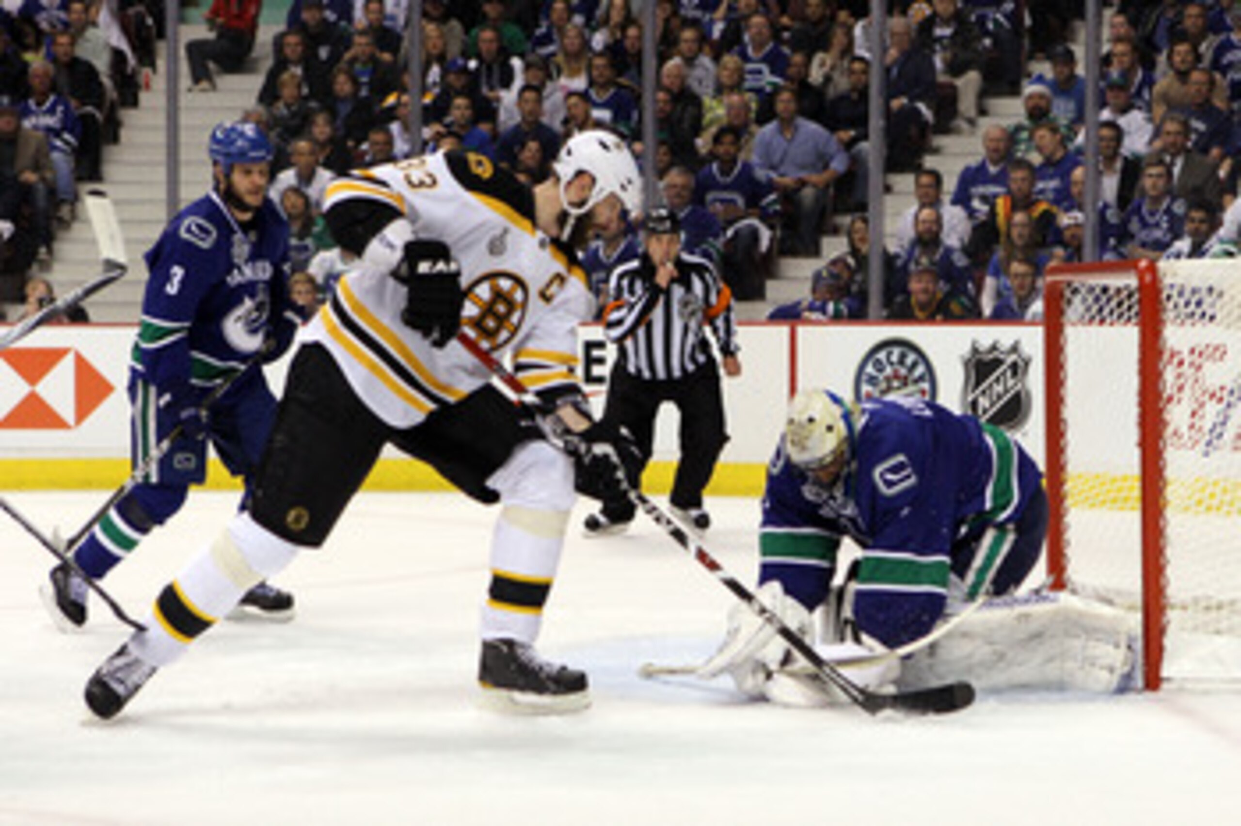 VANCOUVER, BC - JUNE 01:  Zdeno Chara #33 of the Boston Bruins takes a shot against Roberto Luongo #1 of the Vancouver Canucks during game one of the 2011 NHL Stanley Cup Finals at Rogers Arena on June 1, 2011 in Vancouver, Canada.  (Photo by Bruce Bennet