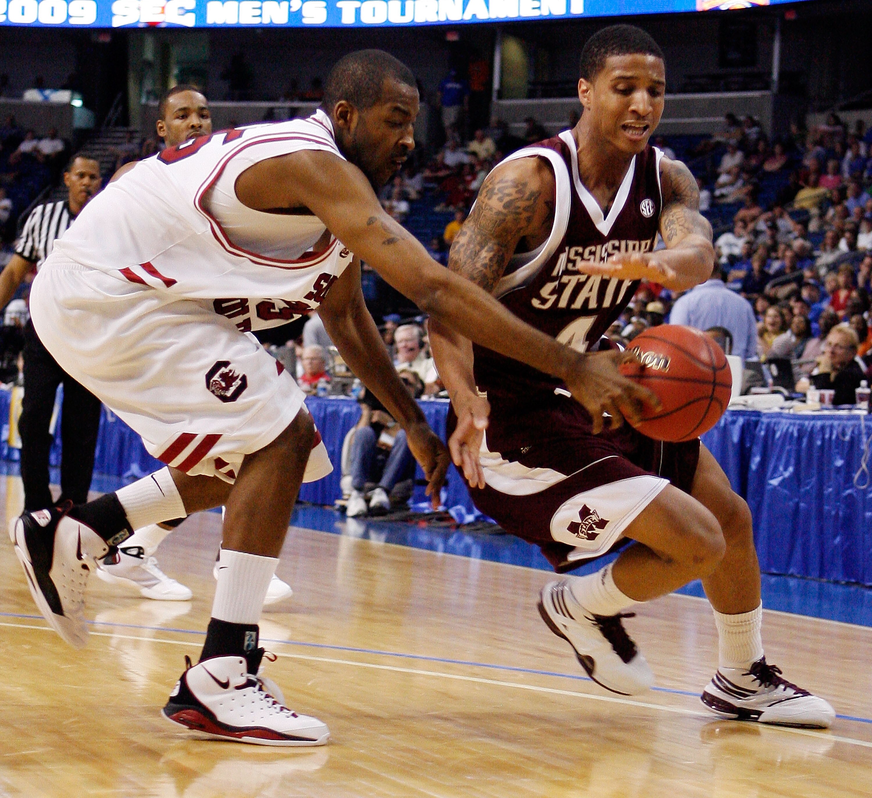 TAMPA, FL - MARCH 13:  Twany Beckham #4 of the Mississippi State Bulldogs fights for a loose ball with Phil Turner #25 of the South Carolina Gamecocks during the quaterfinal round of the SEC Men's Basketball Tournament on March 13, 2009 at The St. Pete Ti