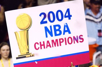 AUBURN HILLS, MI - JUNE 15:  Rasheed Wallace #30 of the Detroit Pistons celebrates with a sign after defeating the Los Angeles Lakers 100-87 in game five of the 2004 NBA Finals on June 15, 2004 at The Palace of Auburn Hills in Auburn Hills, Michigan.  NOT