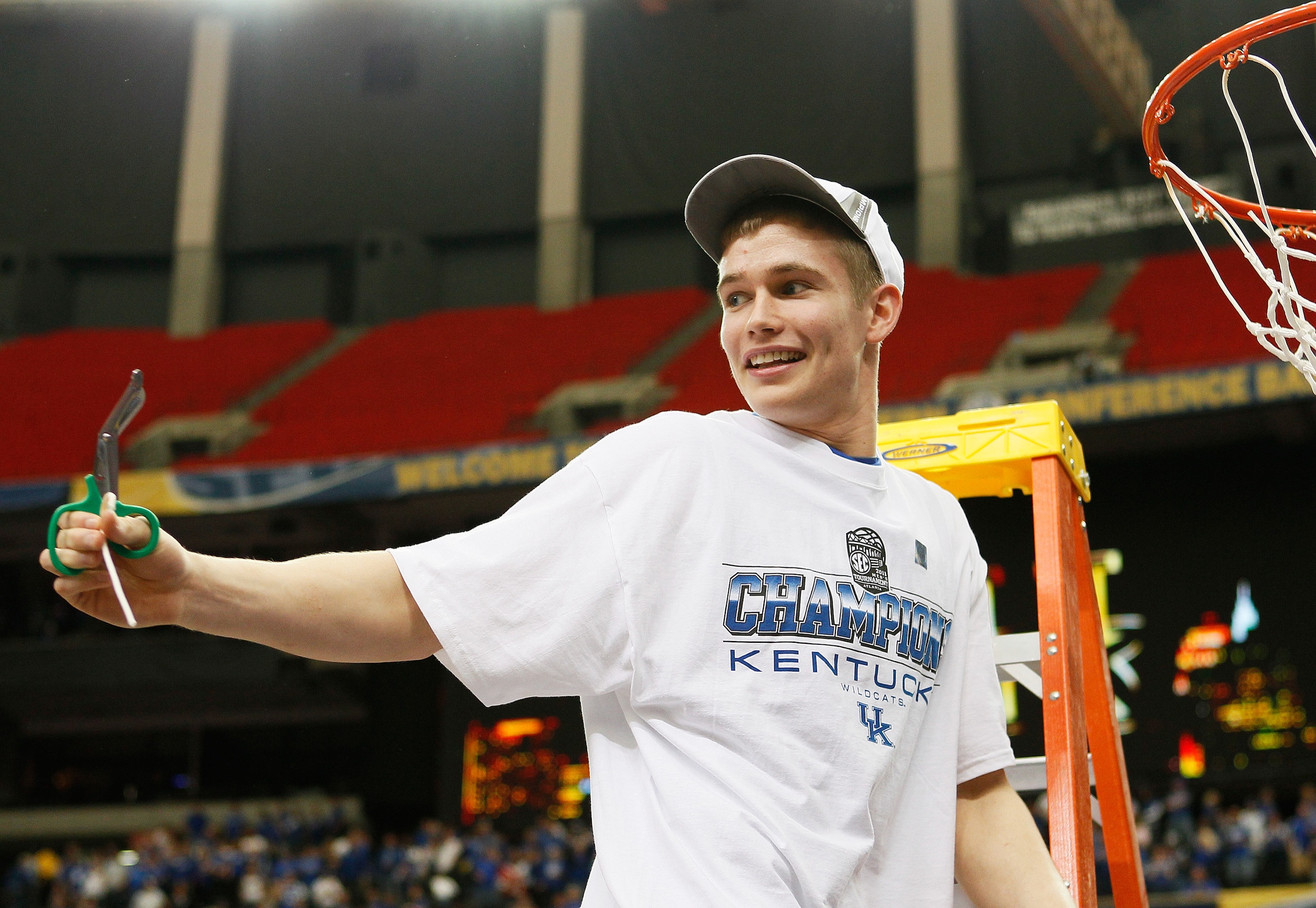 ATLANTA, GA - MARCH 13:  Jarrod Polson #5 of the Kentucky Wildcats cuts off a piece of the next after they defeated the Florida Gators 70 to 54 in the championship game of the SEC Men's Basketball Tournament at Georgia Dome on March 13, 2011 in Atlanta, G