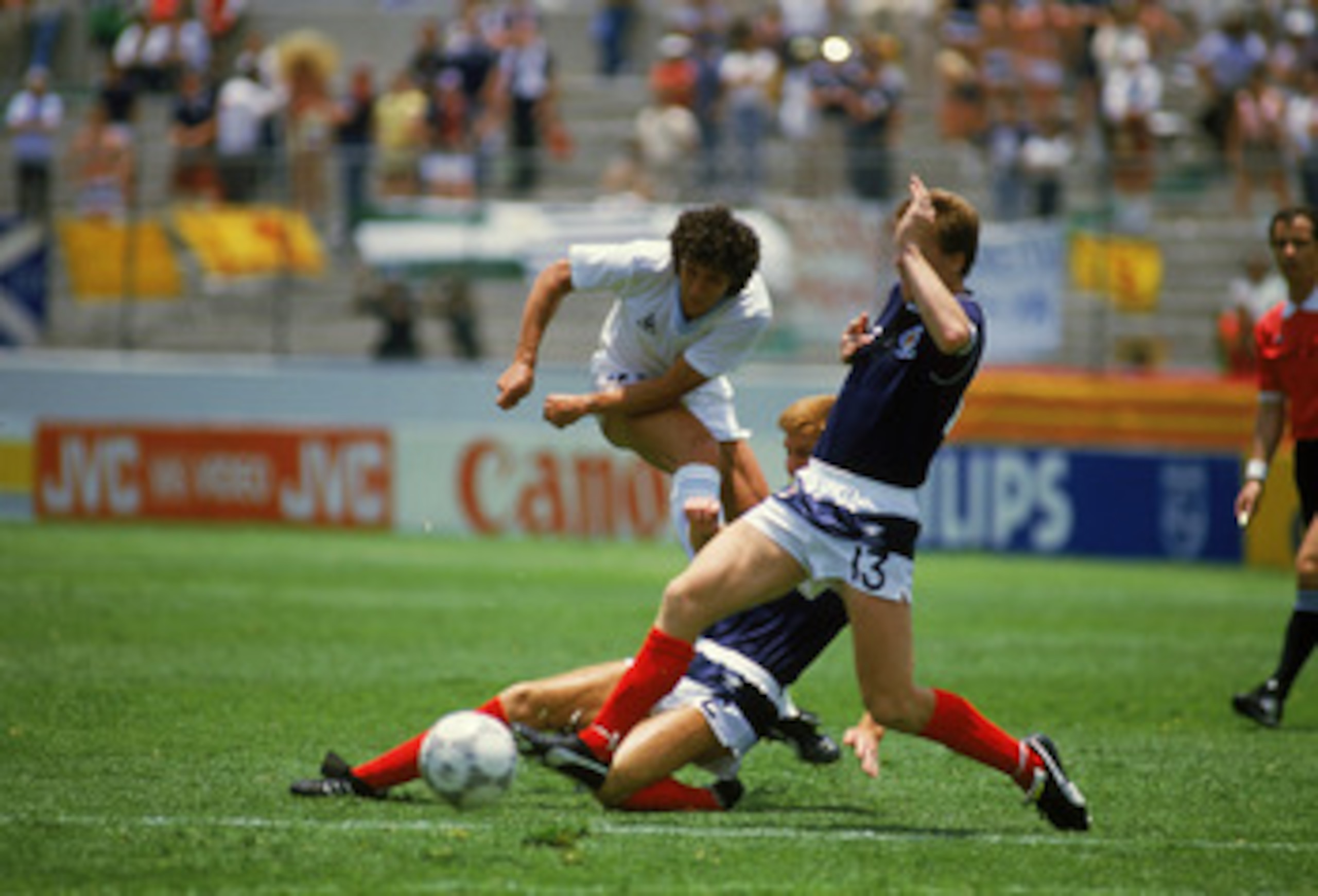 NEZAHUALCOYOTL - JUNE 13:  Wilmar Cabrera of Uruguay has his shot at goal blocked by Richard Gough and Steve Nicol of Scotland during the FIFA World Cup Finals 1986 Group E match between Scotland and Uruguay held on June 13, 1986 at the Neza Stadium in Ne