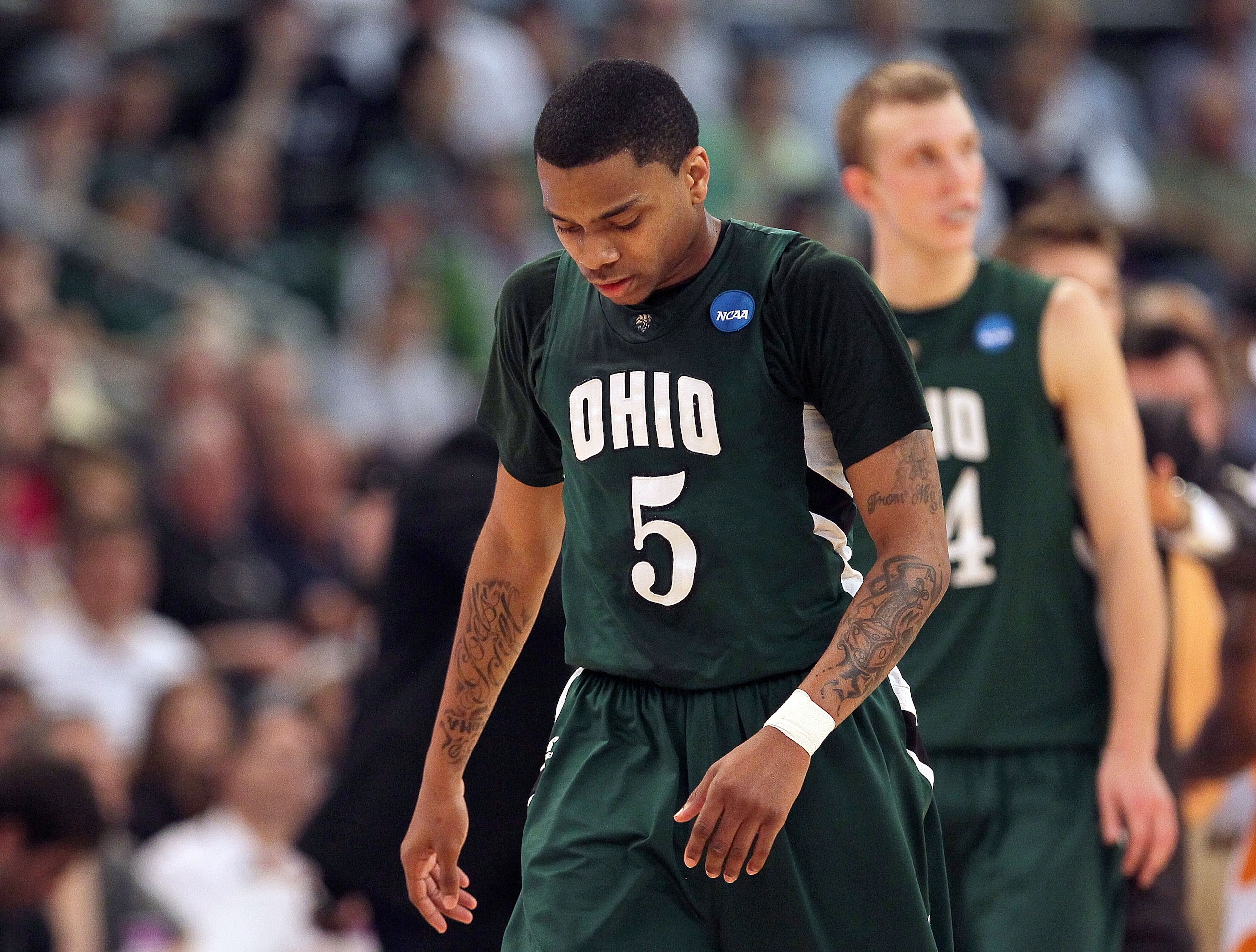 PROVIDENCE, RI - MARCH 20:  D.J. Cooper #5 and Tommy Freeman #25 of the Ohio Bobcats react the Tennessee Volunteers during the second round of the 2010 NCAA men's tournament at Dunkin' Donuts Center on March 20, 2010 in Providence, Rhode Island. (Photo by