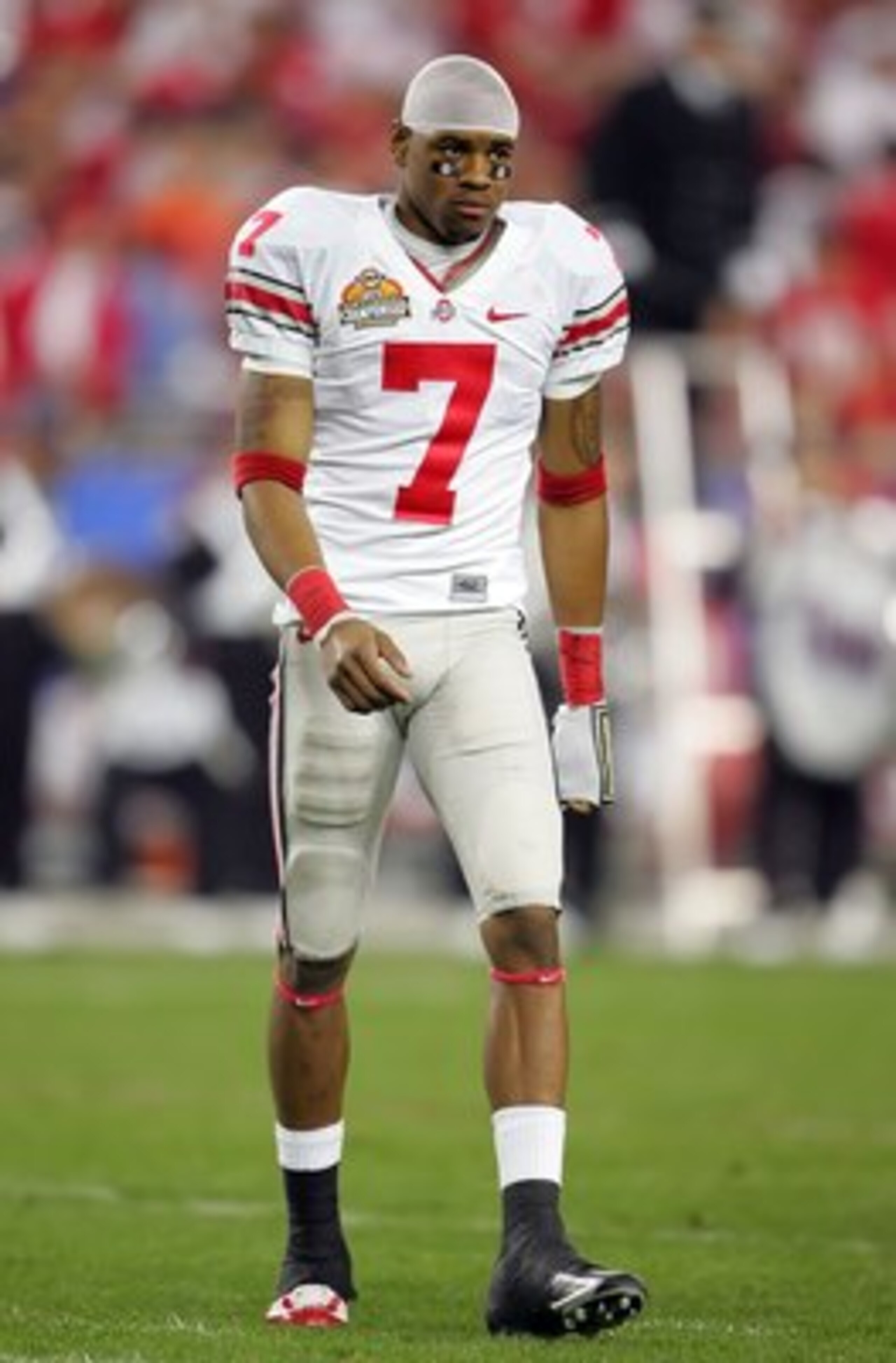 GLENDALE, AZ - JANUARY 08: Ted Ginn Jr. #7 of the Ohio State Buckeyes walks back onto the field after being out the majority of the second quarter with an apparant foot injury during the 2007 Tostitos BCS National Championship Game against the Florida Gat GLENDALE, AZ - JANUARY 08: Ted Ginn Jr. #7 of the Ohio State Buckeyes walks back onto the field after being out the majority of the second quarter with an apparant foot injury during the 2007 Tostitos BCS National Championship Game against the Florida Gat