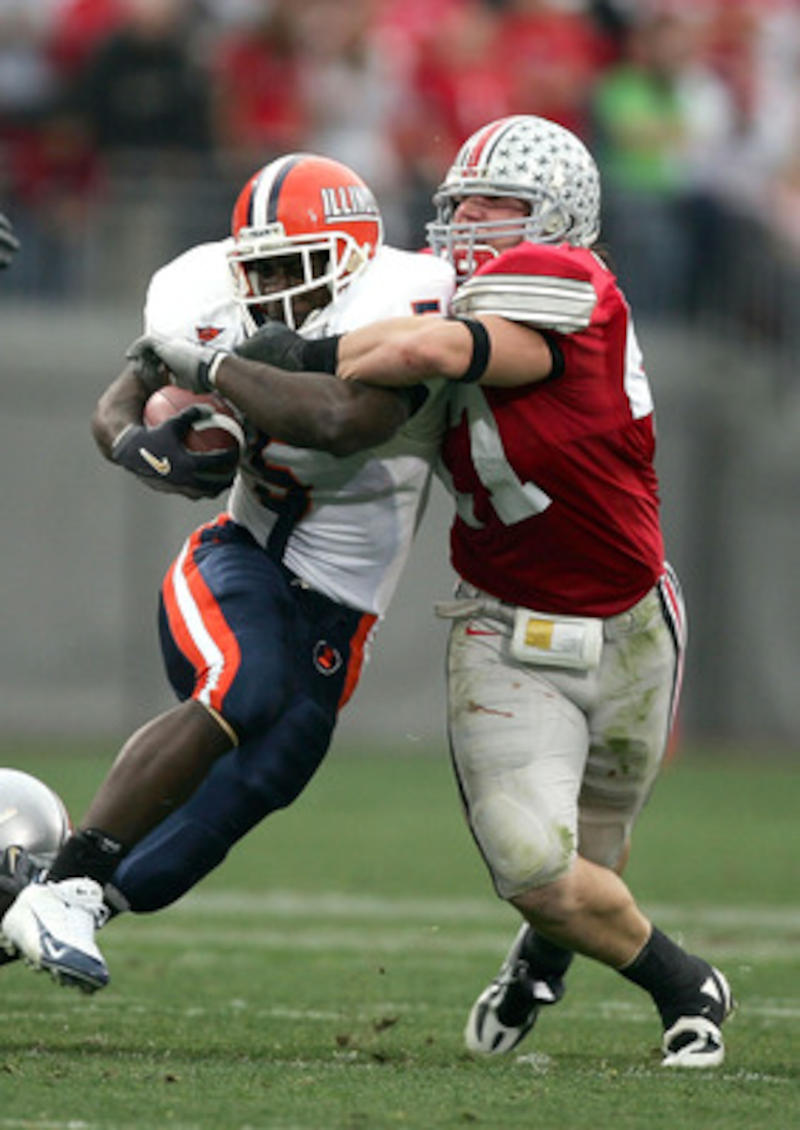 COLUMBUS, OH - NOVEMBER 5: Aaron Hawk #47 of Ohio State makes a tackle on Rashard Mendenhall #5 of Illinois during the second quarter at Ohio Stadium on November 5, 2005 in Columbus, Ohio. Ohios State won 40-2. (Photo by Harry How/Getty Images) COLUMBUS, OH - NOVEMBER 5: Aaron Hawk #47 of Ohio State makes a tackle on Rashard Mendenhall #5 of Illinois during the second quarter at Ohio Stadium on November 5, 2005 in Columbus, Ohio. Ohios State won 40-2. (Photo by Harry How/Getty Images)