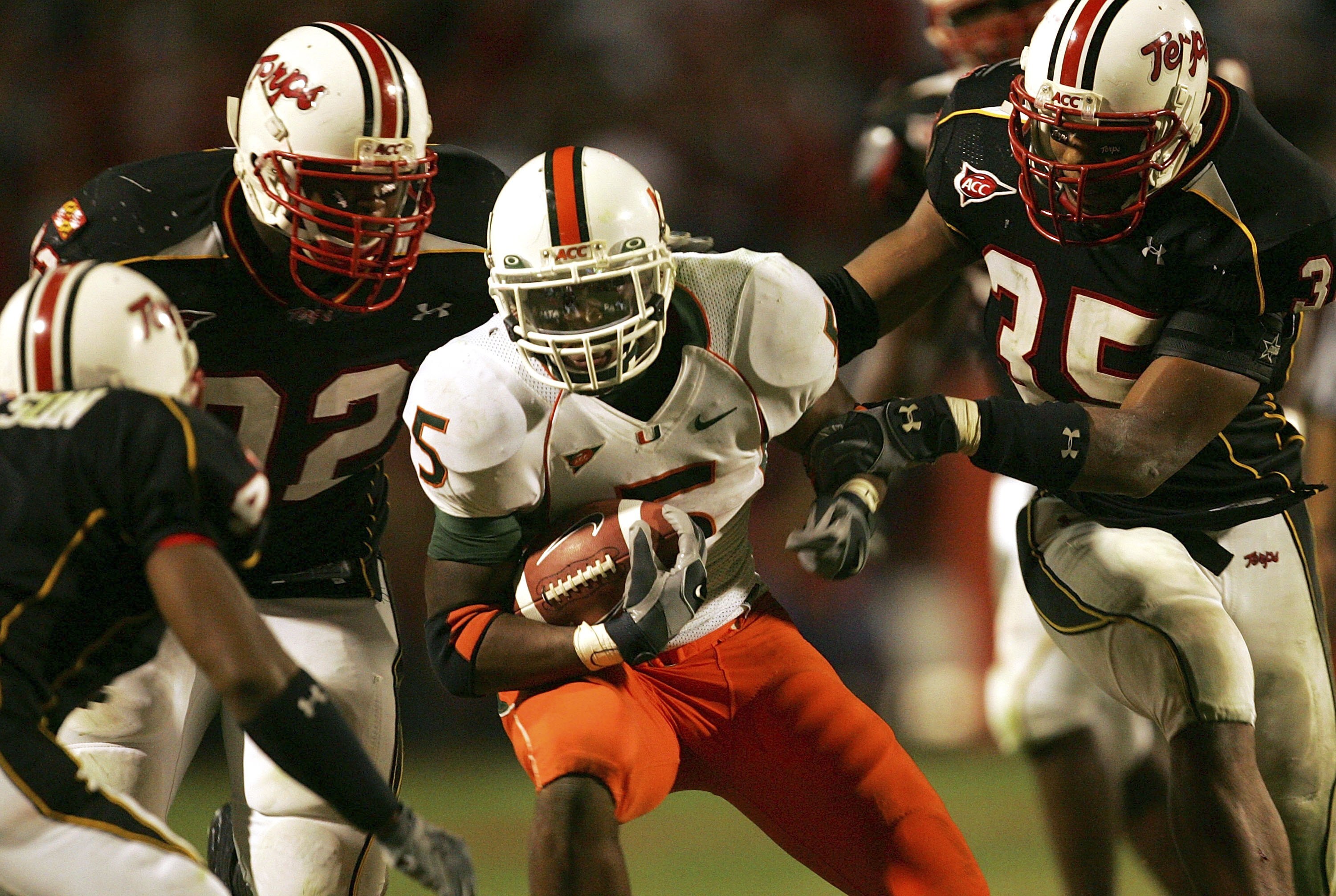 COLLEGE PARK, MD - NOVEMBER 11:  Javarris James #5 of the Miami Hurricanes carries the ball as the Maryland Terrapins defend during the game on November 11, 2006 at Byrd Stadium in College Park, Maryland.  (Photo by Jamie Squire/Getty Images)