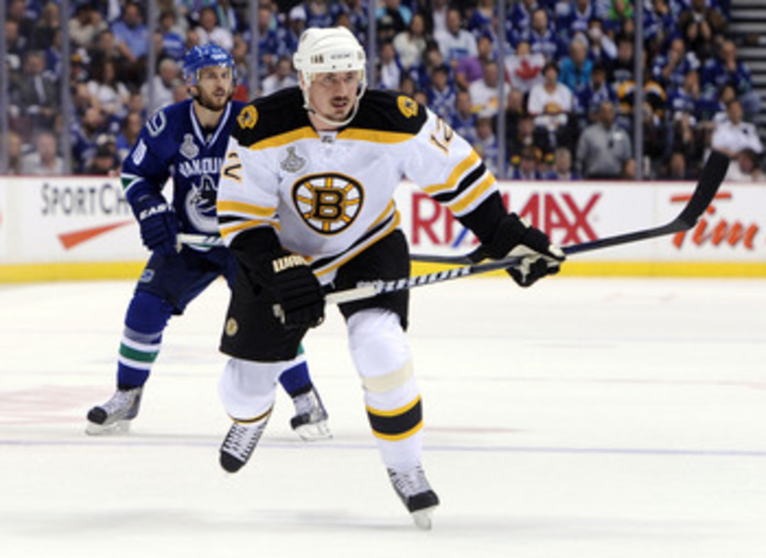 VANCOUVER, BC - JUNE 01:  Tomas Kaberle #12 of the Boston Bruins skates against Jeff Tambellini #10 of the Vancouver Canucks during game one of the 2011 NHL Stanley Cup Finals at Rogers Arena on June 1, 2011 in Vancouver, Canada.  (Photo by Harry How/Gett