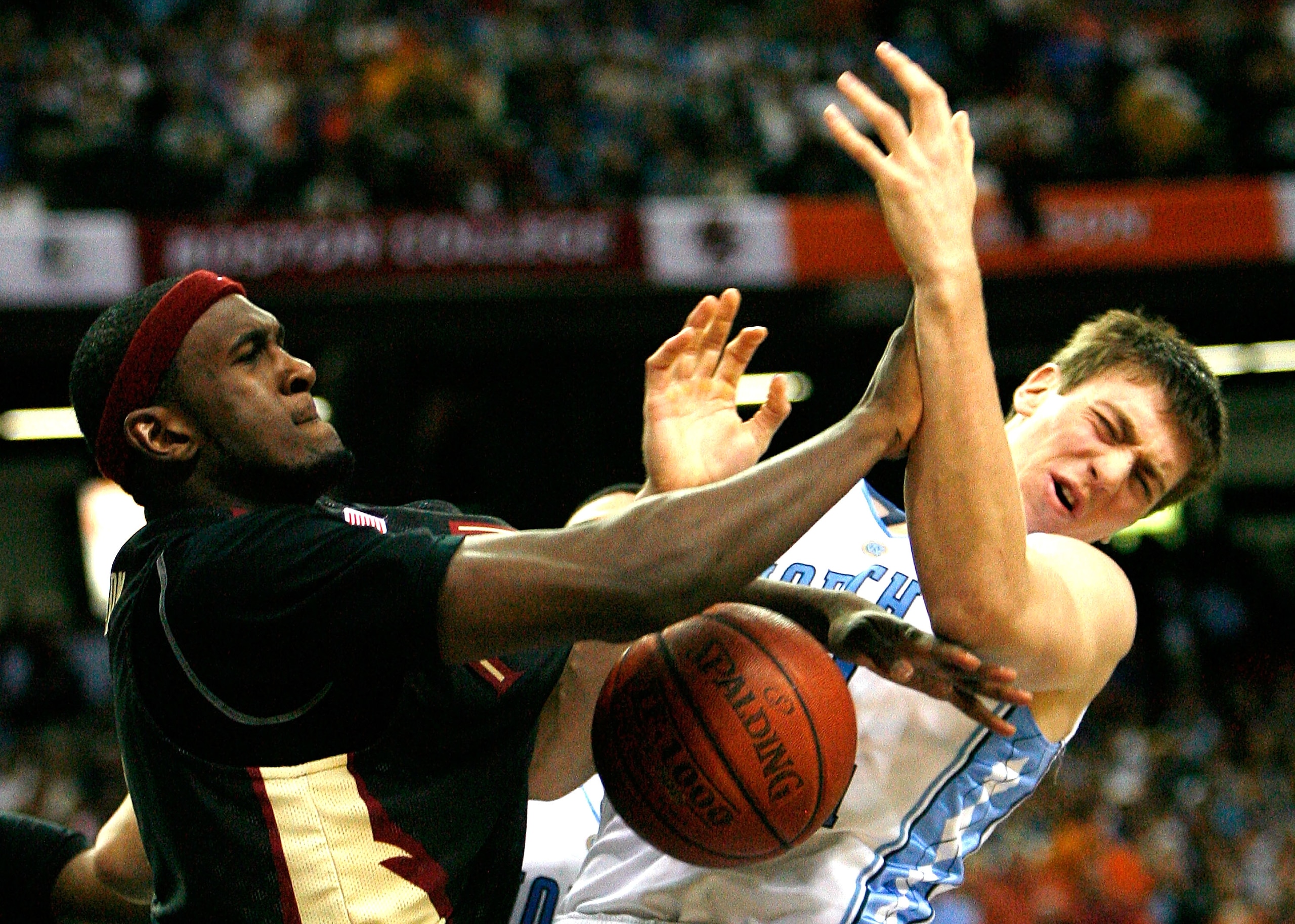 ATLANTA - MARCH 14:  Chris Singleton #31 of the Florida State Seminoles fouls Tyler Hansbrough #50 of the North Carolina Tar Heels during the semifinals of the 2009 ACC Men's Basketball Tournament on March 14, 2009 at the Georgia Dome in Atlanta, Georgia.
