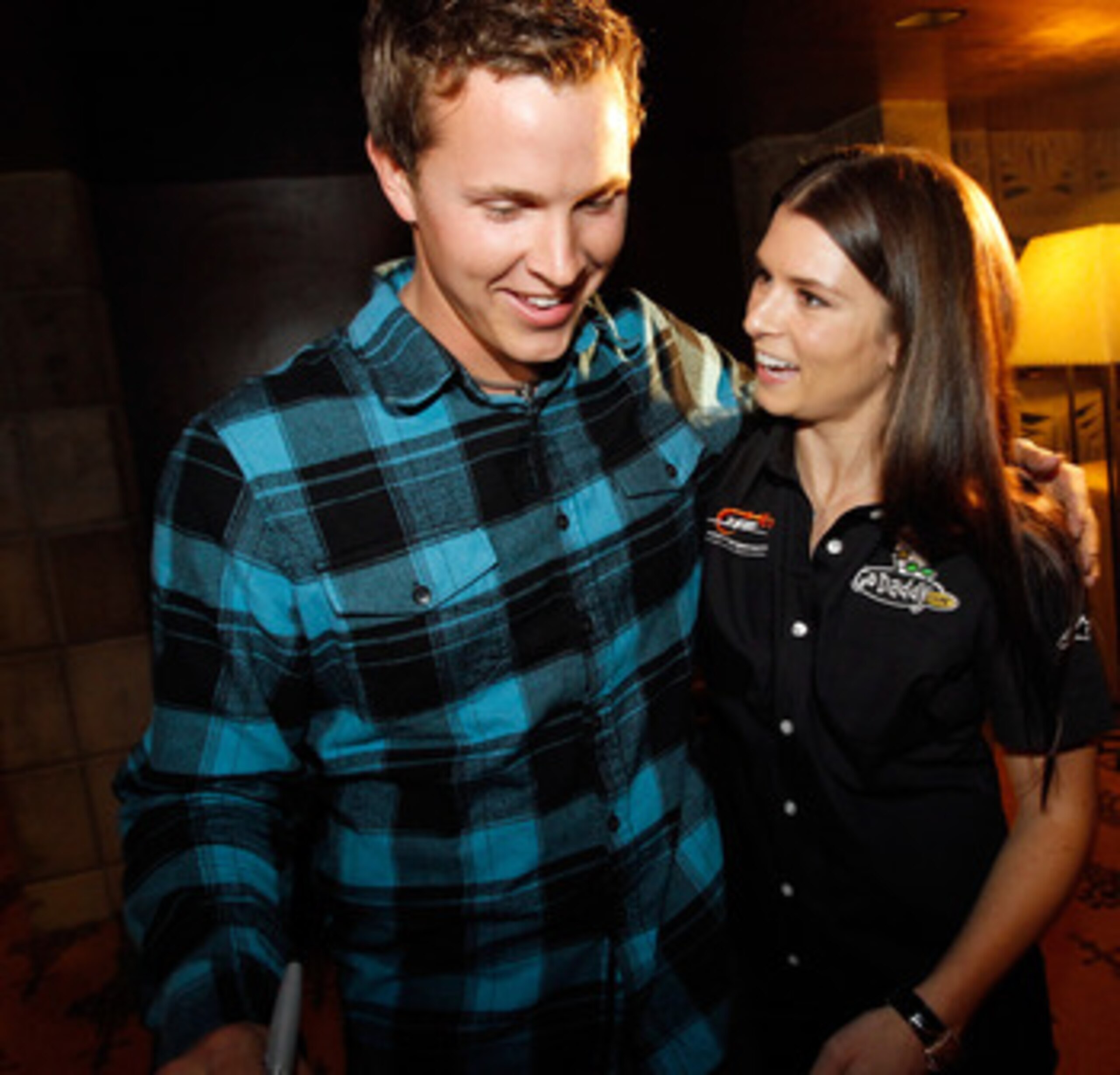 PHOENIX, AZ - FEBRUARY 24:  53rd Daytona 500 champion Trevor Bayne gis congratulated by NASCAR driver Danica Patrick February 24, 2011 in Phoenix, Arizona. Bayne and Patrick made a special appearance at Phoenix International Raceway's annual 'Night of Cha