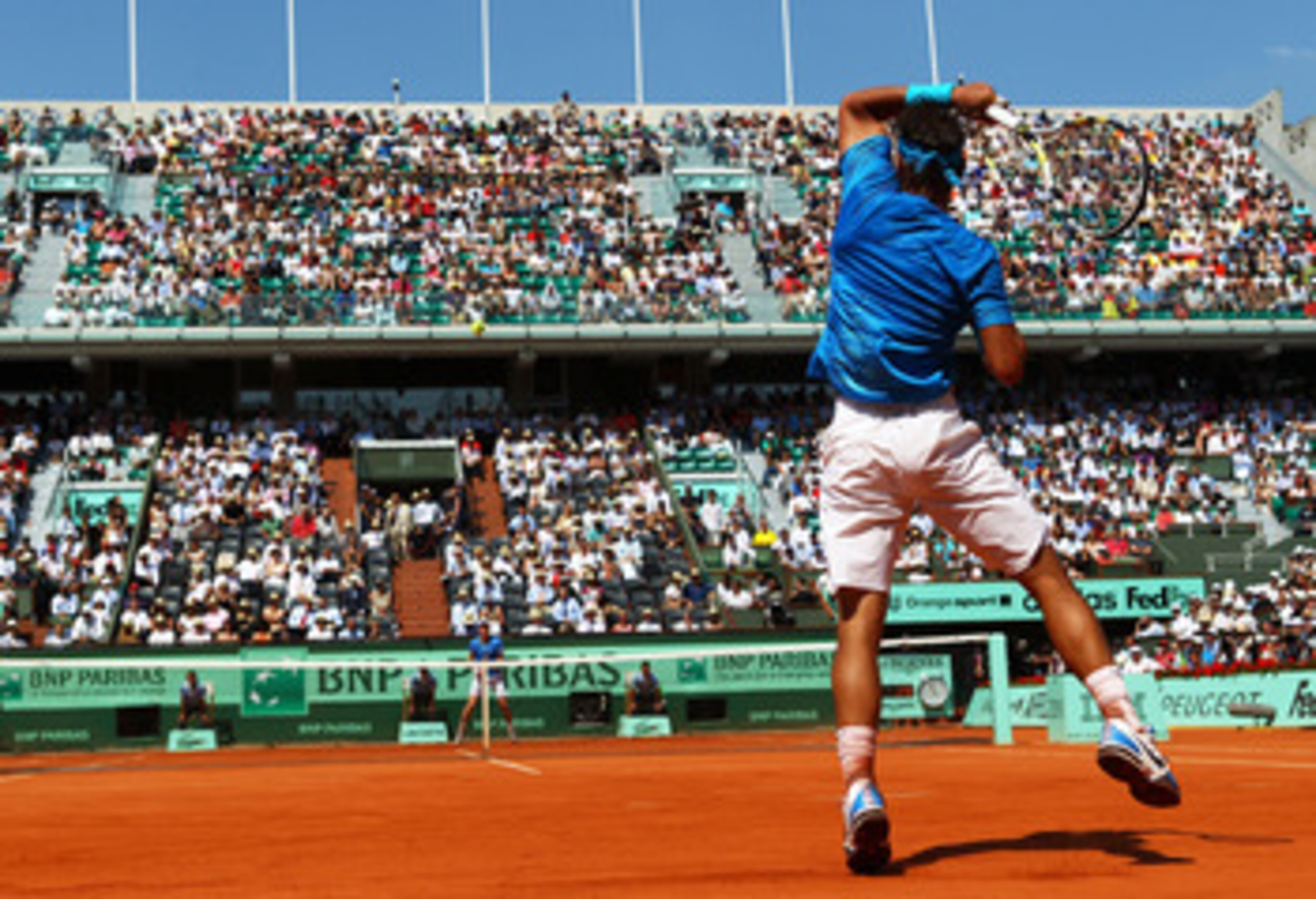 PARIS, FRANCE - JUNE 03: Rafael Nadal of Spain hits a forehand during the men's singles semi final match between Rafael Nadal of Spain and Andy Murray of Great Britain on day thirteen of the French Open at Roland Garros on June 3, 2011 in Paris, France. PARIS, FRANCE - JUNE 03: Rafael Nadal of Spain hits a forehand during the men's singles semi final match between Rafael Nadal of Spain and Andy Murray of Great Britain on day thirteen of the French Open at Roland Garros on June 3, 2011 in Paris, France.
