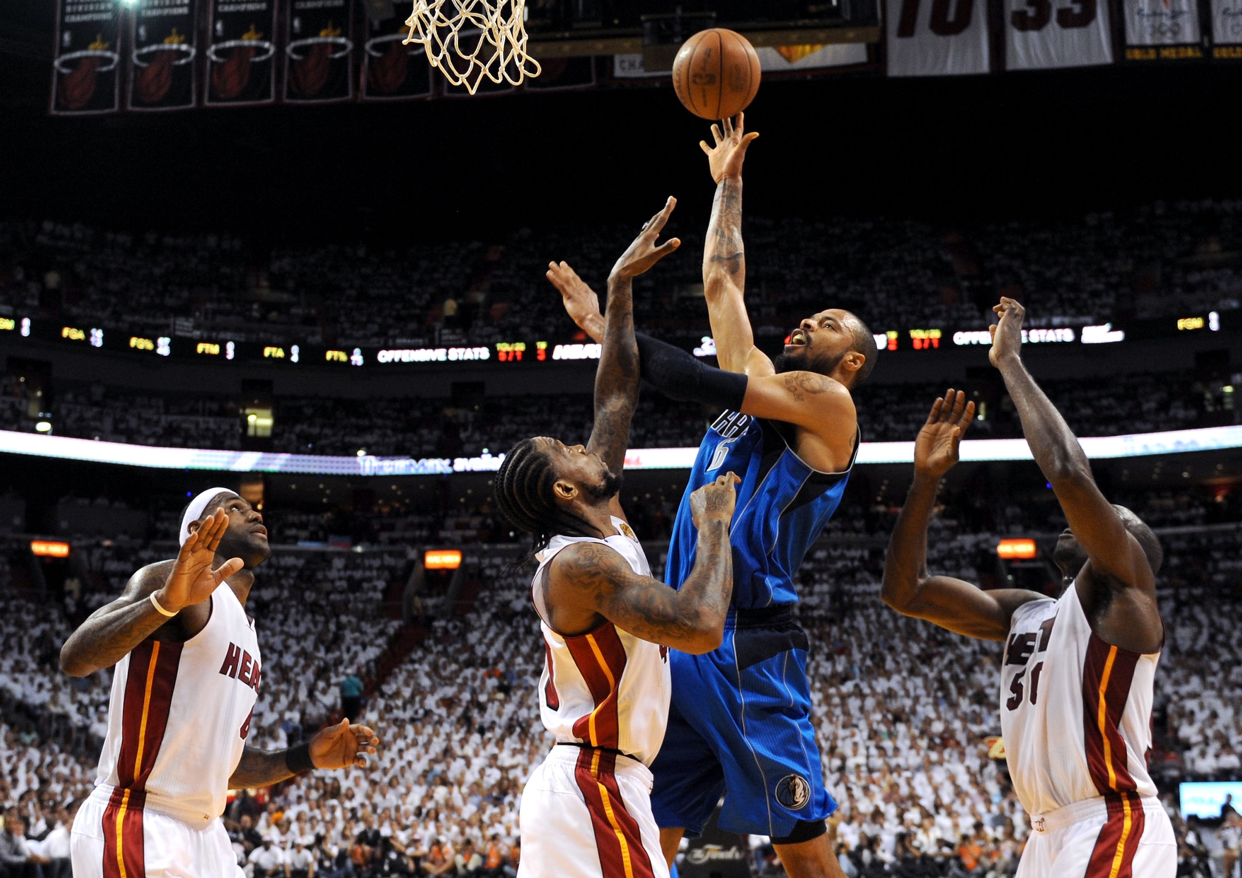 MIAMI, FL - JUNE 02:  Tyson Chandler #6 of the Dallas Mavericks attempts a shot against LeBron James #6, Udonis Haslem #40 and Joel Anthony #50 of the Miami Heat in Game Two of the 2011 NBA Finals at American Airlines Arena on June 2, 2011 in Miami, Flori