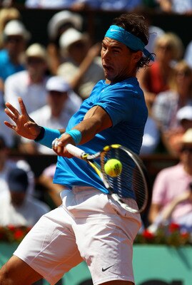 PARIS, FRANCE - JUNE 03:  Rafael Nadal of Spain hits a forehand during the men's singles semi final match between Rafael Nadal of Spain and Andy Murray of Great Britain on day thirteen of the French Open at Roland Garros on June 3, 2011 in Paris, France.