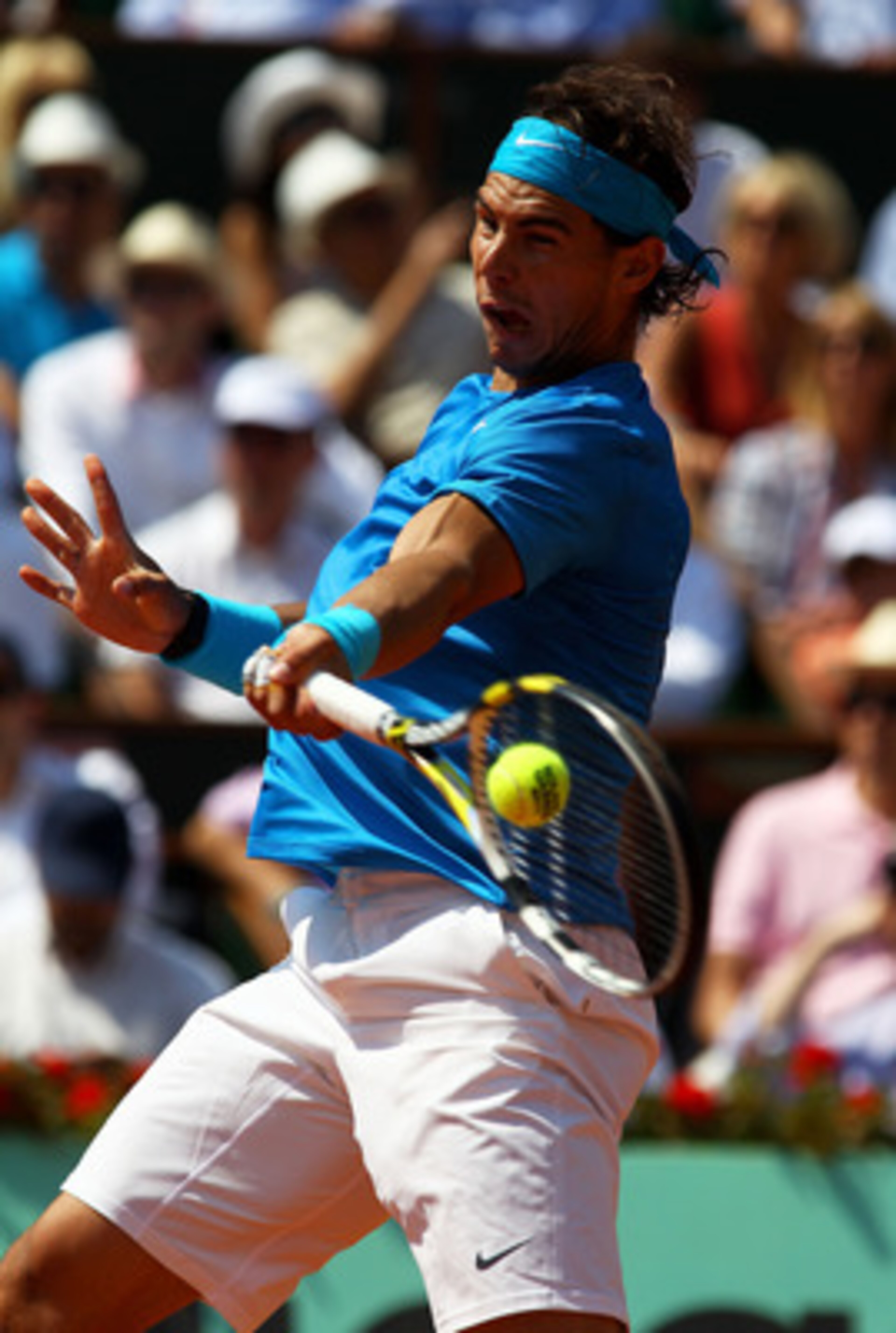 PARIS, FRANCE - JUNE 03: Rafael Nadal of Spain hits a forehand during the men's singles semi final match between Rafael Nadal of Spain and Andy Murray of Great Britain on day thirteen of the French Open at Roland Garros on June 3, 2011 in Paris, France. PARIS, FRANCE - JUNE 03: Rafael Nadal of Spain hits a forehand during the men's singles semi final match between Rafael Nadal of Spain and Andy Murray of Great Britain on day thirteen of the French Open at Roland Garros on June 3, 2011 in Paris, France.