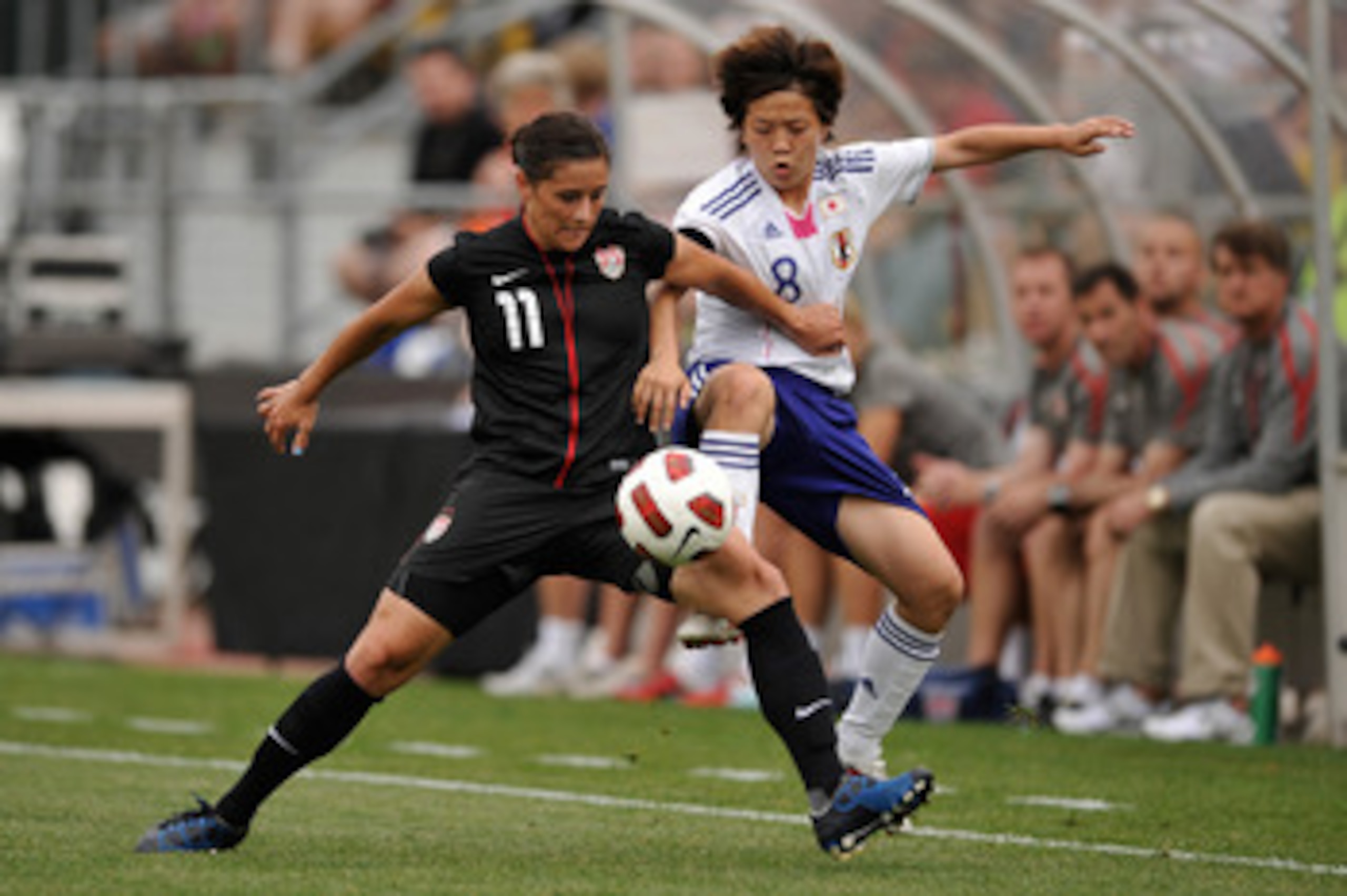 COLUMBUS, OH - MAY 14:  Ali Krieger #11 of the United States battles for control of the ball with Aya Miyama #8 of Japan on May 14, 2011 at Crew Stadium in Columbus, Ohio.  (Photo by Jamie Sabau/Getty Images)