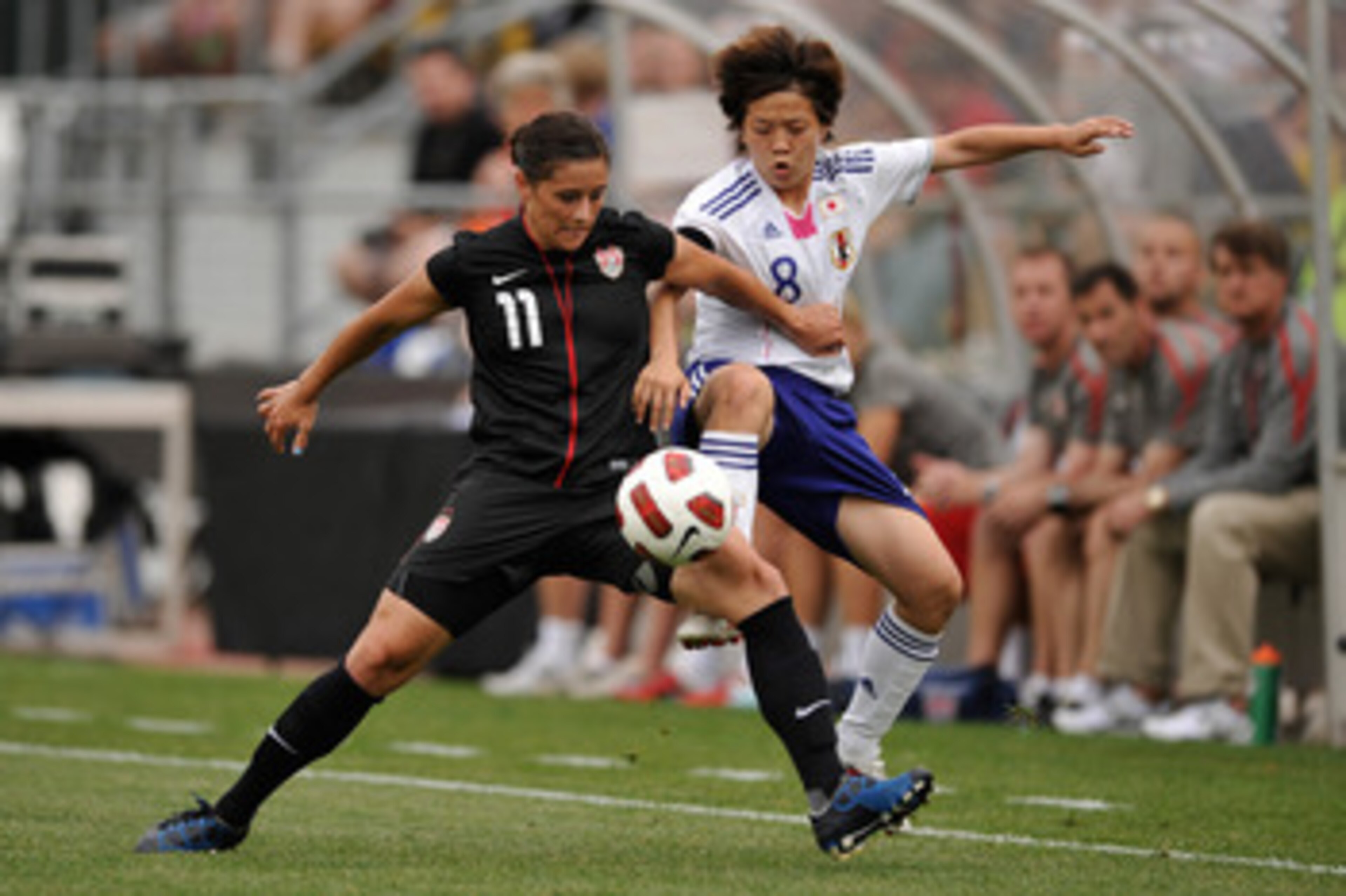 COLUMBUS, OH - MAY 14:  Ali Krieger #11 of the United States battles for control of the ball with Aya Miyama #8 of Japan on May 14, 2011 at Crew Stadium in Columbus, Ohio.  (Photo by Jamie Sabau/Getty Images)