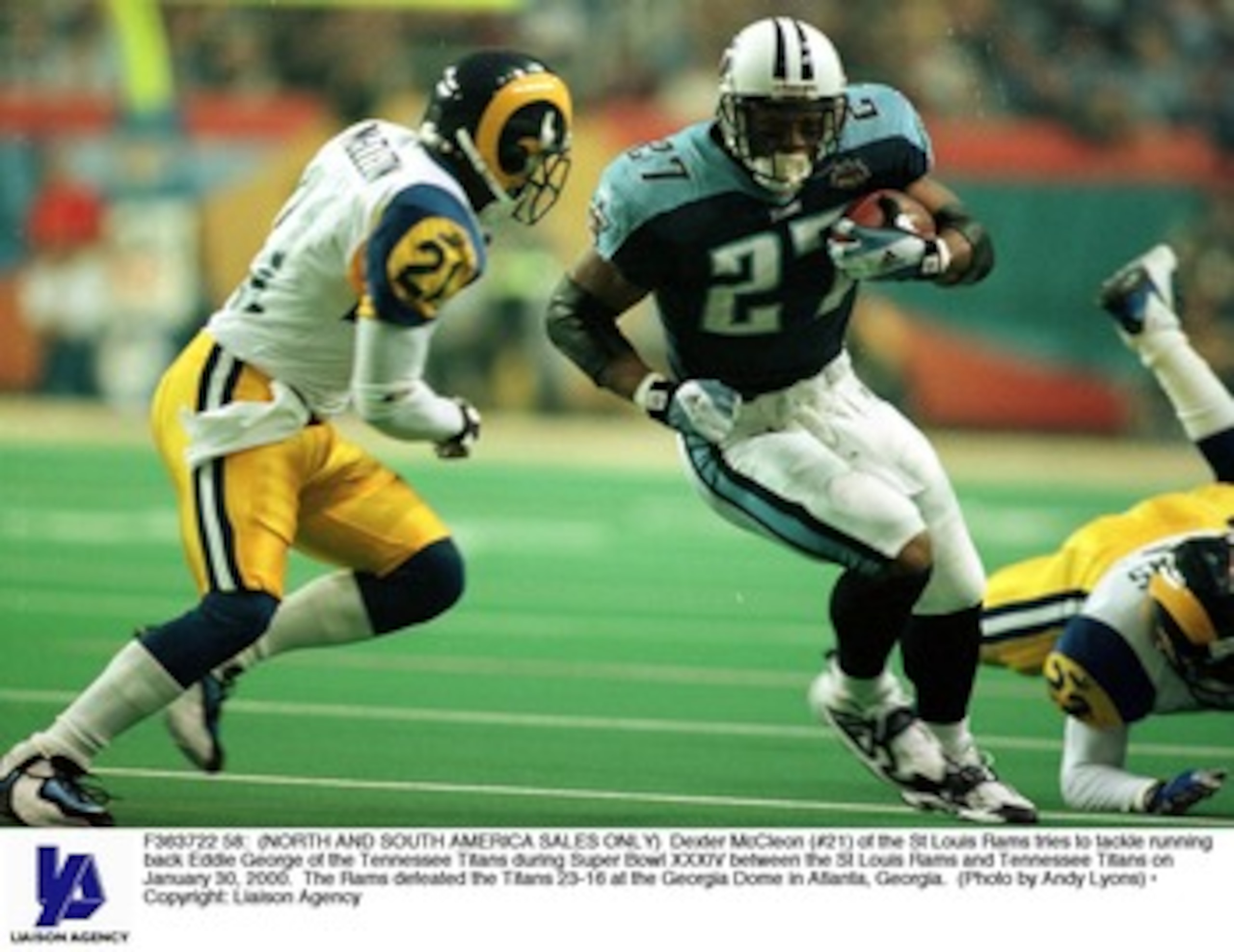 F363722 58: (NORTH AND SOUTH AMERICA SALES ONLY) Dexter McCleon (#21) of the St Louis Rams tries to tackle running back Eddie George of the Tennessee Titans during Super Bowl XXXIV between the St Louis Rams and Tennessee Titans on January 30, 2000. The Ra