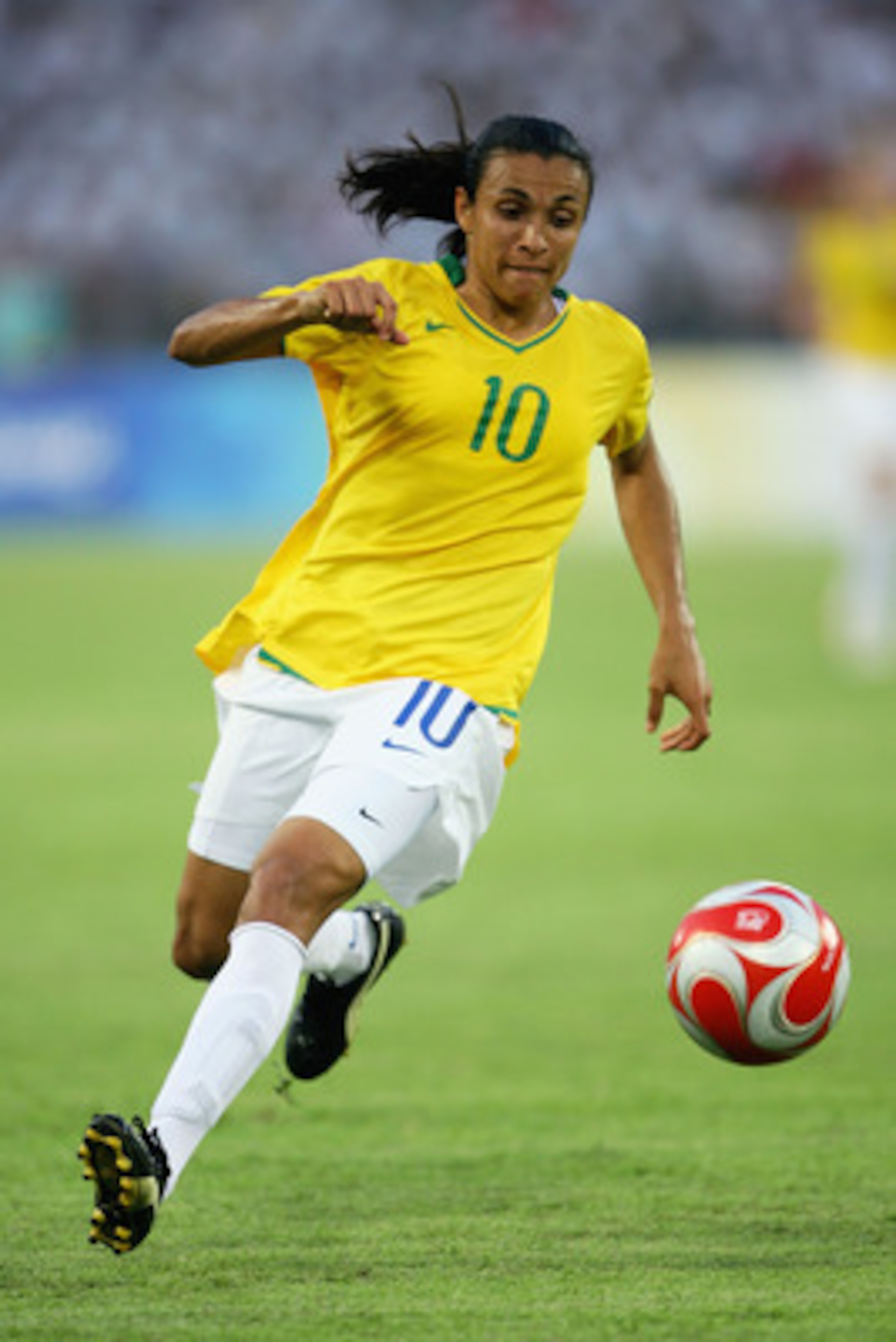 BEIJING - AUGUST 12:  Marta of Brazil runs with the ball during the Women's First Round Group F match between Nigeria and Brazil at the Workers' Stadium on Day 4 of the Beijing 2008 Olympic Games on August 12, 2008 in Beijing, China.  (Photo by Jeff Gross
