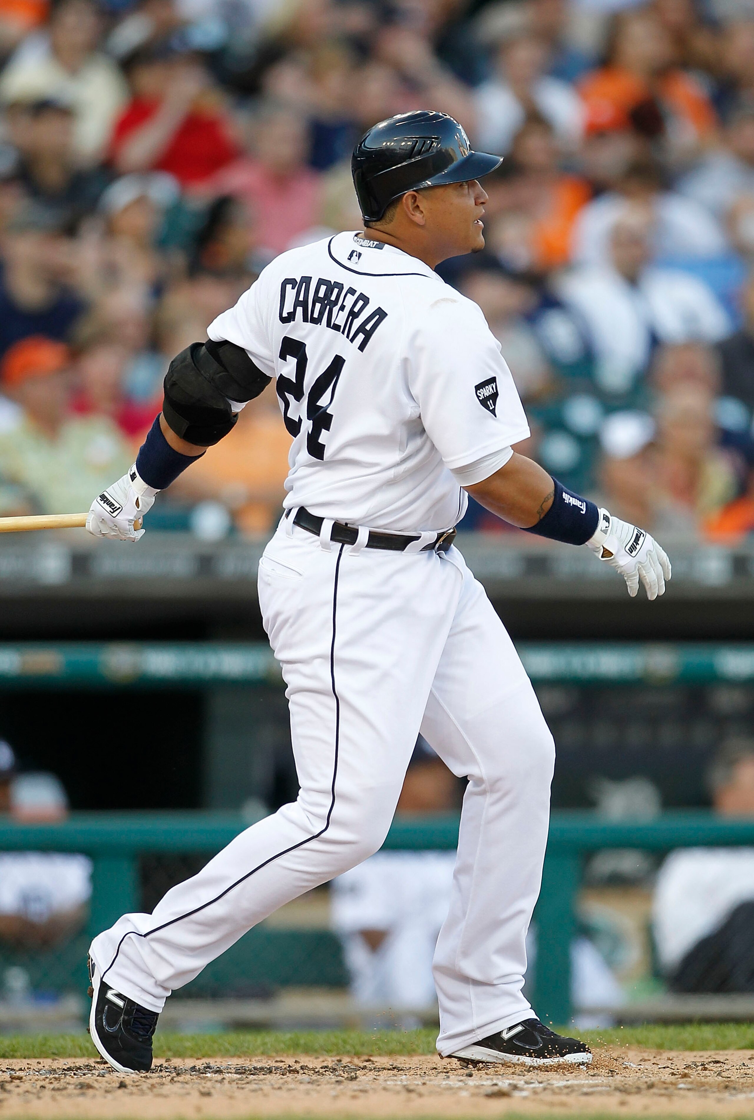 DETROIT - JUNE 01: Miguel Cabrera #24 of the Detroit Tigers hits a three run home run in the third inning scoring Brennan Boesch #26 and Ramon Santiago #39 during the game against the Minnesota Twins at Comerica Park on June 1, 2011 in Detroit, Michigan.