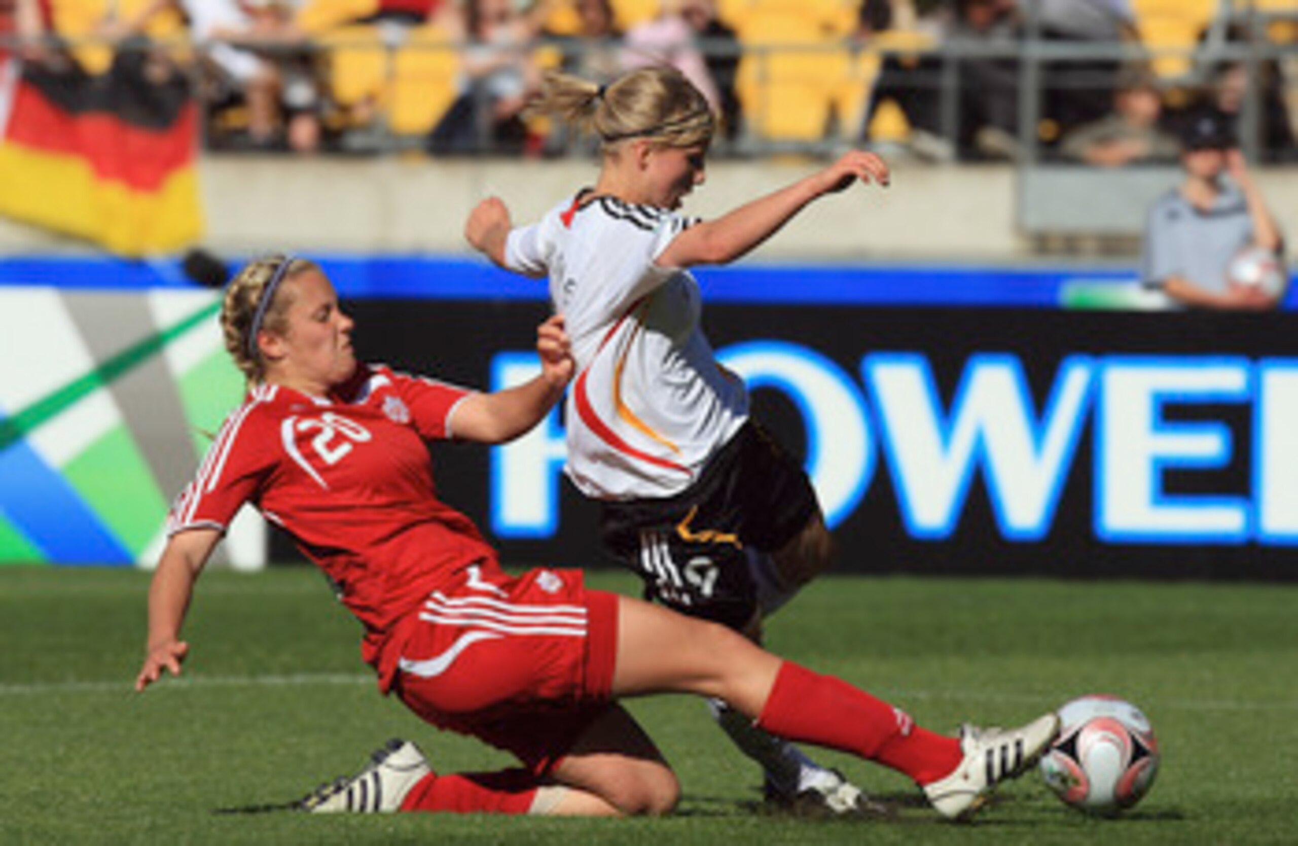 WELLINGTON, NEW ZEALAND - NOVEMBER 08: Tabea Kemme of Germany gets tackled by Lauren Granberg of Canada during the FIFA U-17 Women`s World Cup Quarter final match between Germany and Canada at the Westpac Stadium on November 8, 2008 in Wellington, New Zea