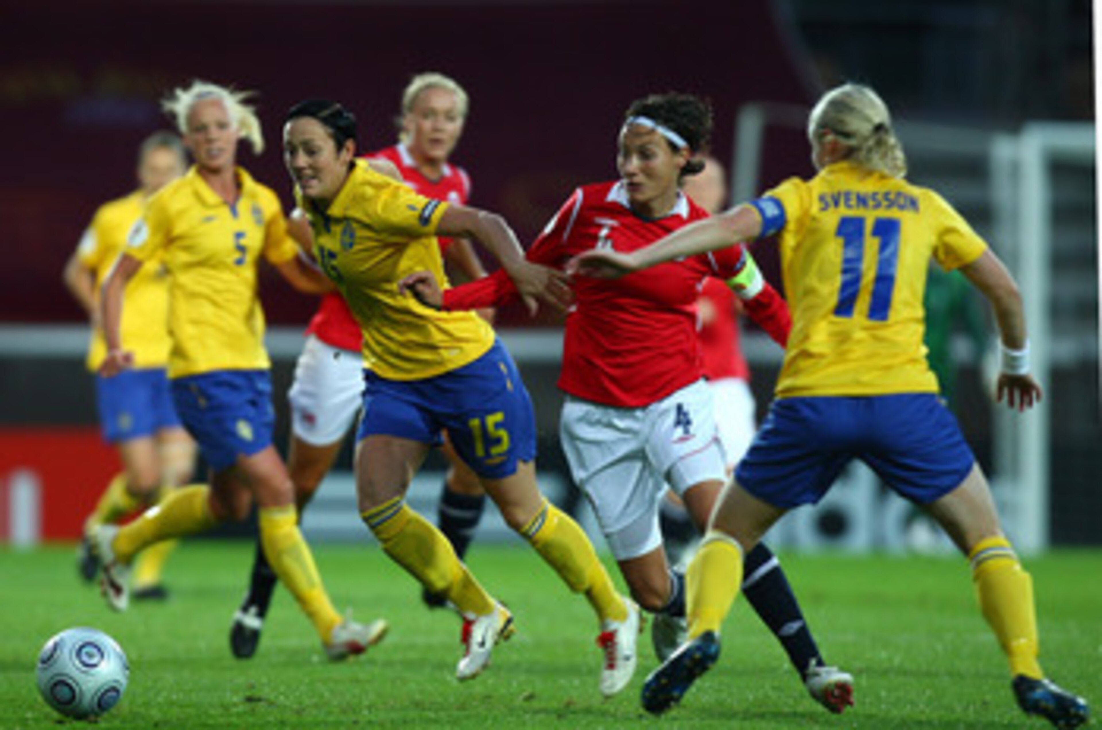 HELSINKI, FINLAND - SEPTEMBER 04:  Ingvild Stensland of Norway tries to tackle Therese Sjogran of Sweden during the UEFA Women's Euro 2009 Quarter-Final match between Sweden and Norway at the Helsinki football stadium on September 4, 2009 in Helsinki, Fin