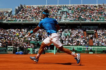 PARIS, FRANCE - JUNE 03:  Rafael Nadal of Spain hits a forehand during the men's singles semi final match between Rafael Nadal of Spain and Andy Murray of Great Britain on day thirteen of the French Open at Roland Garros on June 3, 2011 in Paris, France. 