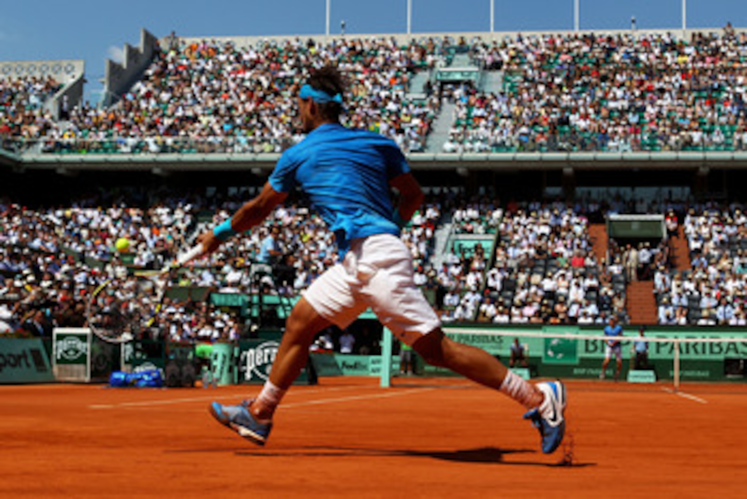 PARIS, FRANCE - JUNE 03:  Rafael Nadal of Spain hits a forehand during the men's singles semi final match between Rafael Nadal of Spain and Andy Murray of Great Britain on day thirteen of the French Open at Roland Garros on June 3, 2011 in Paris, France. 