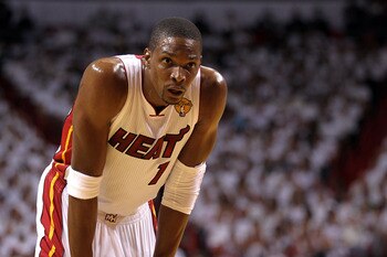 MIAMI, FL - MAY 31:  Chris Bosh #1 of the Miami Heat looks on against the Dallas Mavericks in Game One of the 2011 NBA Finals at American Airlines Arena on May 31, 2011 in Miami, Florida. NOTE TO USER: User expressly acknowledges and agrees that, by downl