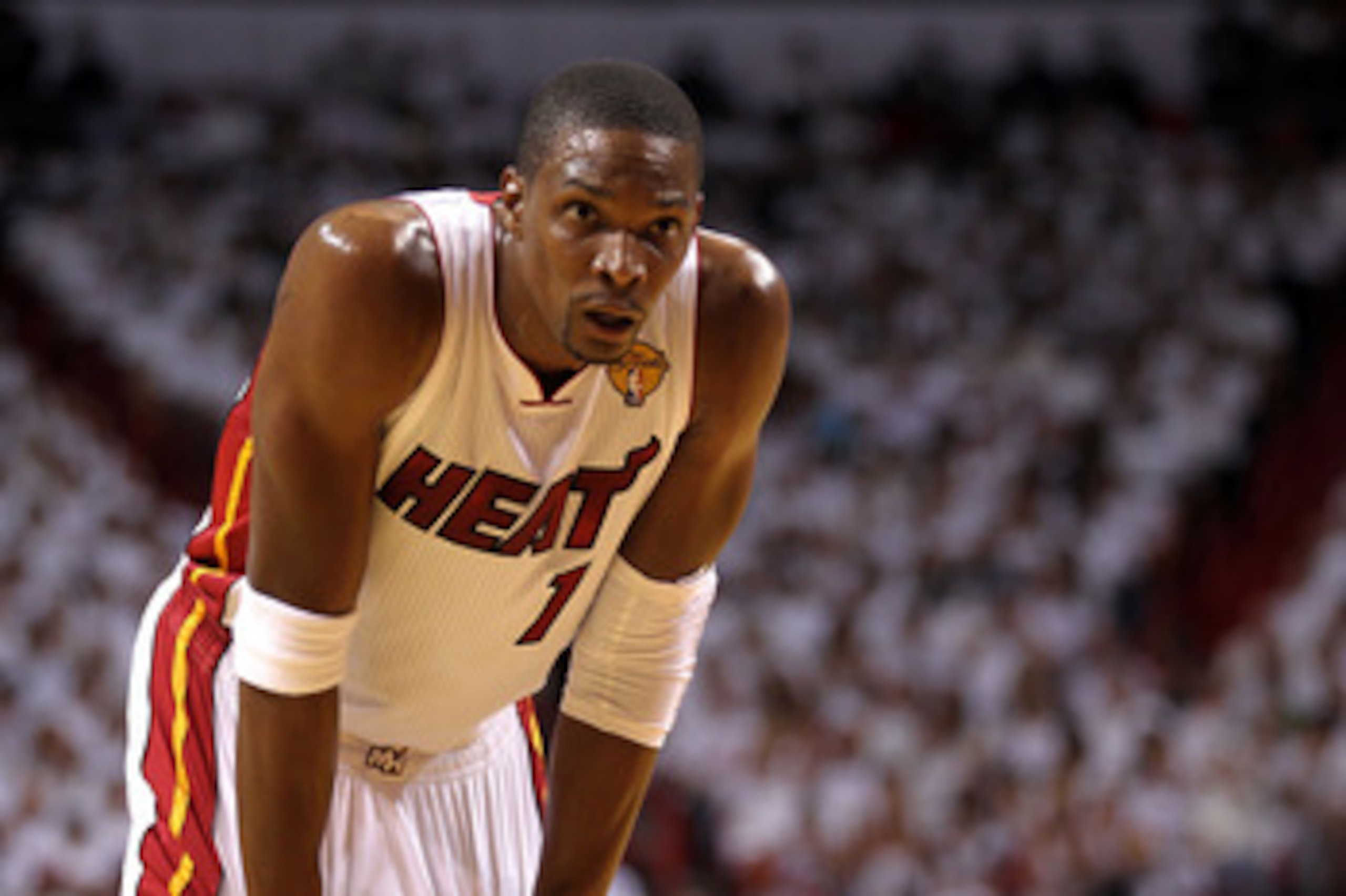 MIAMI, FL - MAY 31:  Chris Bosh #1 of the Miami Heat looks on against the Dallas Mavericks in Game One of the 2011 NBA Finals at American Airlines Arena on May 31, 2011 in Miami, Florida. NOTE TO USER: User expressly acknowledges and agrees that, by downl