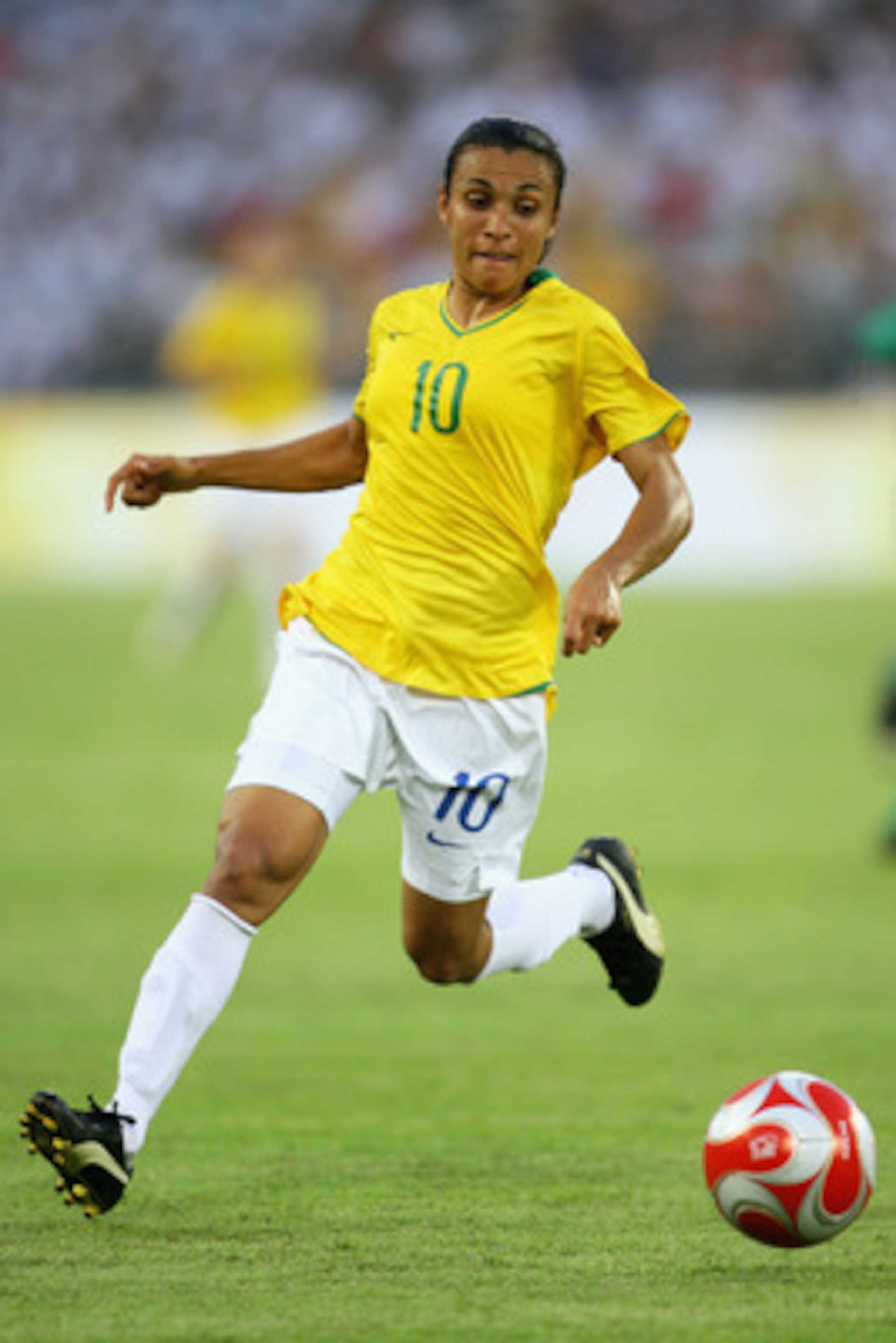 BEIJING - AUGUST 12:  Marta of Brazil runs with the ball during the Women's First Round Group F match between Nigeria and Brazil at the Workers' Stadium on Day 4 of the Beijing 2008 Olympic Games on August 12, 2008 in Beijing, China.  (Photo by Jeff Gross