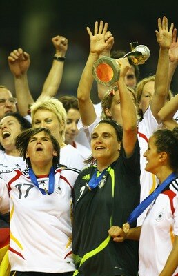 SHANGHAI, CHINA - SEPTEMBER 30: Nadine Angerer (R) and Ariane Hingst (L) of Germany lift the Women's World Cup after their victory in the Women's World Cup 2007 Final between Brazil and Germany at Shanghai Hongkou Football Stadium on September 30, 2007 i SHANGHAI, CHINA - SEPTEMBER 30: Nadine Angerer (R) and Ariane Hingst (L) of Germany lift the Women's World Cup after their victory in the Women's World Cup 2007 Final between Brazil and Germany at Shanghai Hongkou Football Stadium on September 30, 2007 i