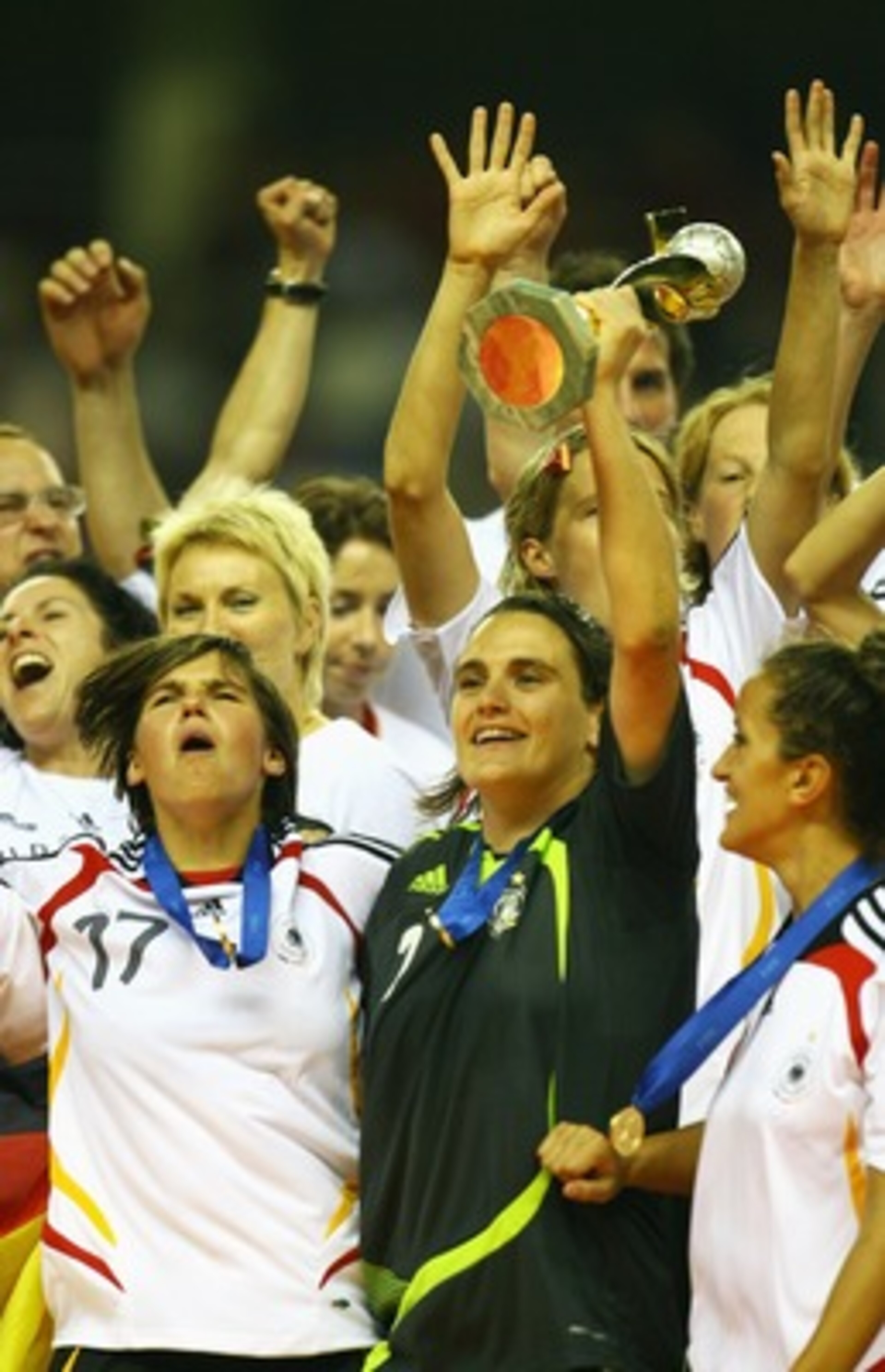 SHANGHAI, CHINA - SEPTEMBER 30:  Nadine Angerer (R) and Ariane Hingst (L) of Germany lift the Women's World Cup after their victory in the Women's World Cup 2007 Final between Brazil and Germany at Shanghai Hongkou Football Stadium on September 30, 2007 i