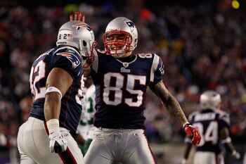 FOXBORO, MA - JANUARY 16:  Aaron Hernandez #85 and Alge Crumpler #82 of the New England Patriots celebrate Crumpler's catch during their 2011 AFC divisional playoff game at Gillette Stadium on January 16, 2011 in Foxboro, Massachusetts.  (Photo by Jim Rog