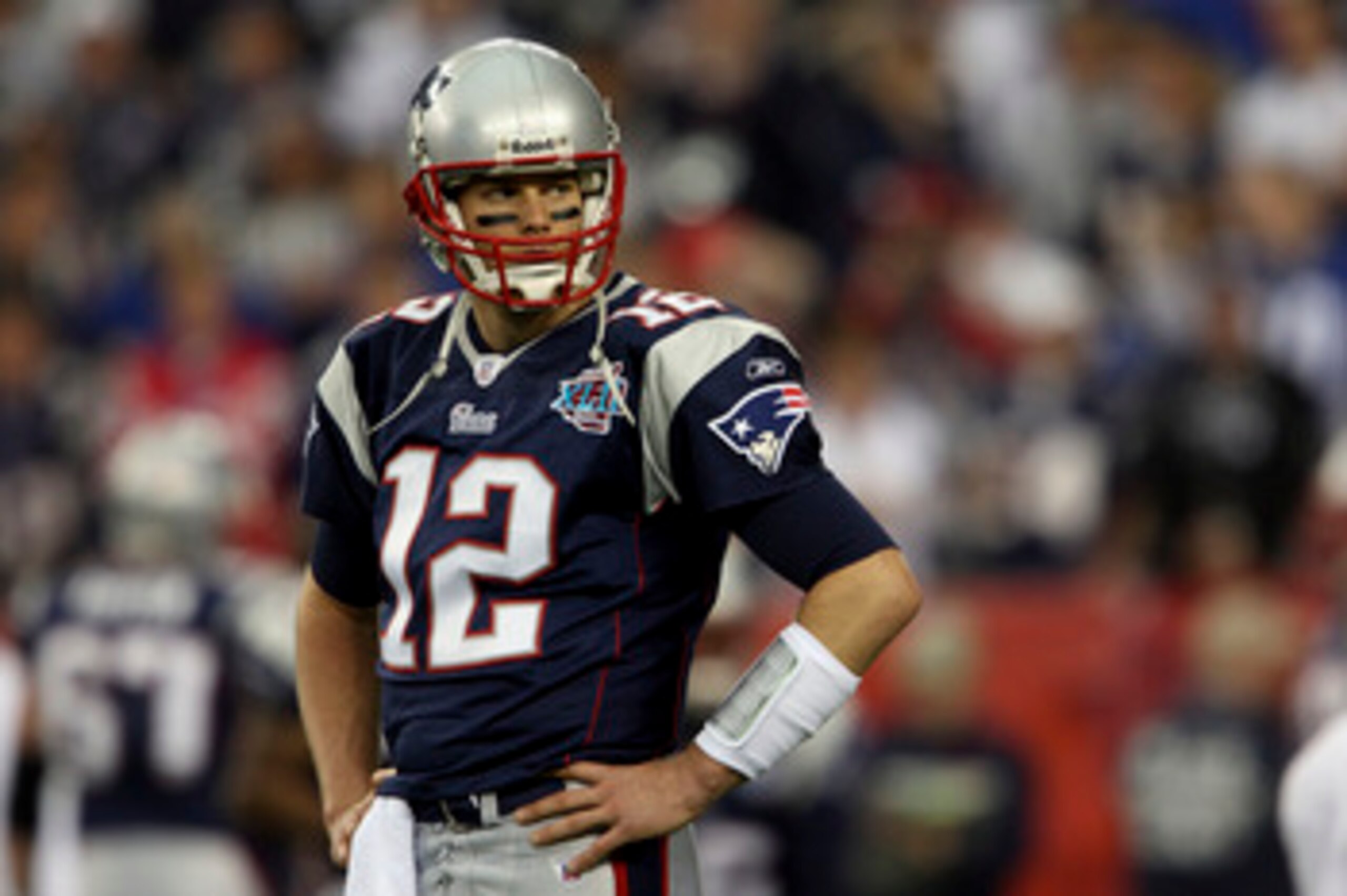 GLENDALE, AZ - FEBRUARY 03:  Quarterback Tom Brady #12 of the New England Patriots looks on during Super Bowl XLII against the New York Giants on February 3, 2008 at the University of Phoenix Stadium in Glendale, Arizona. The Giants defeated the Patriots 