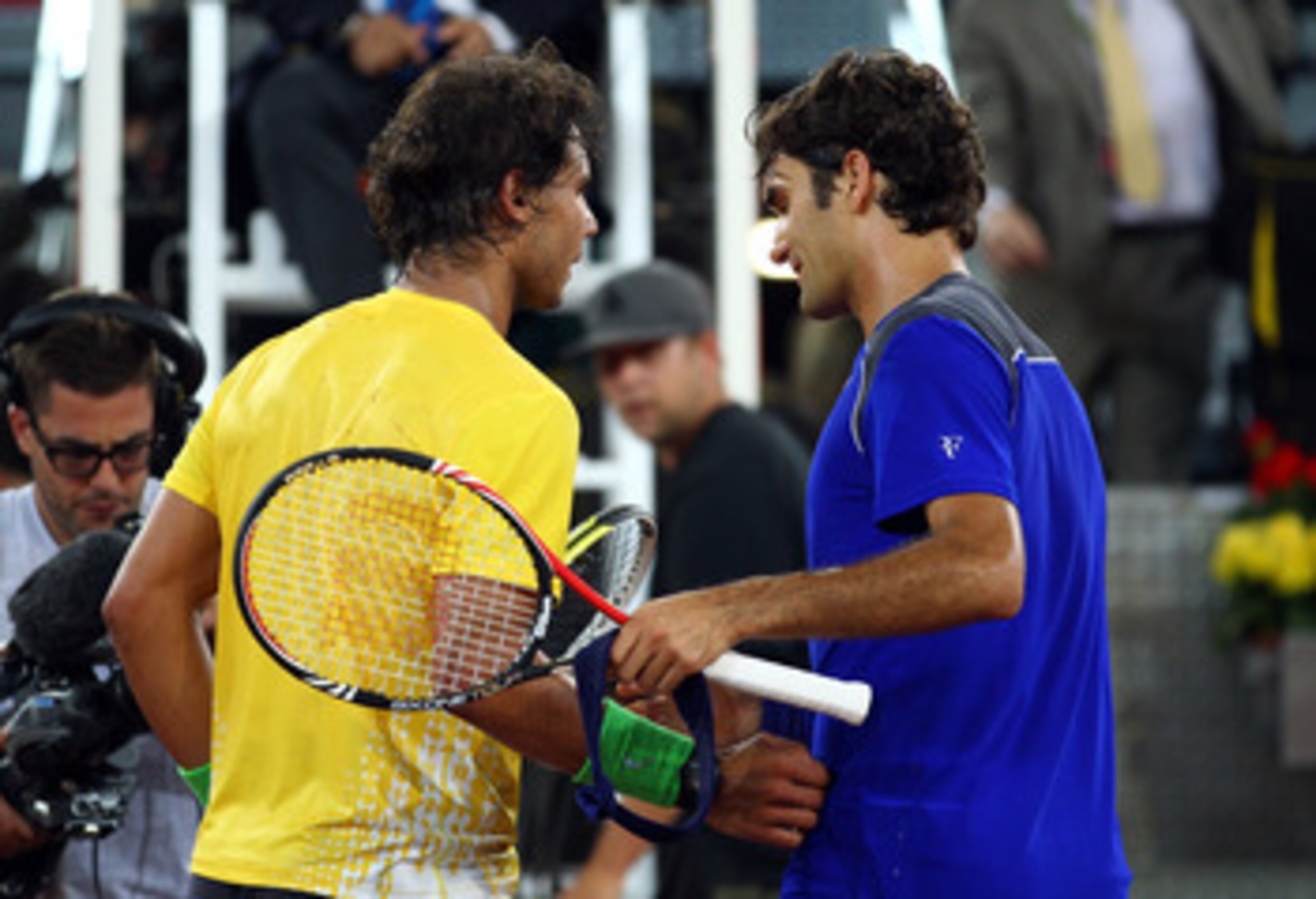 MADRID, SPAIN - MAY 07: Roger Federer of Switzerland shakes hands with Rafael Nadal of Spain after Nadal won in 3 sets during day eight of the Mutua Madrilena Madrid Open Tennis on May 7, 2011 in Madrid, Spain. (Photo by Julian Finney/Getty Images) MADRID, SPAIN - MAY 07: Roger Federer of Switzerland shakes hands with Rafael Nadal of Spain after Nadal won in 3 sets during day eight of the Mutua Madrilena Madrid Open Tennis on May 7, 2011 in Madrid, Spain. (Photo by Julian Finney/Getty Images)
