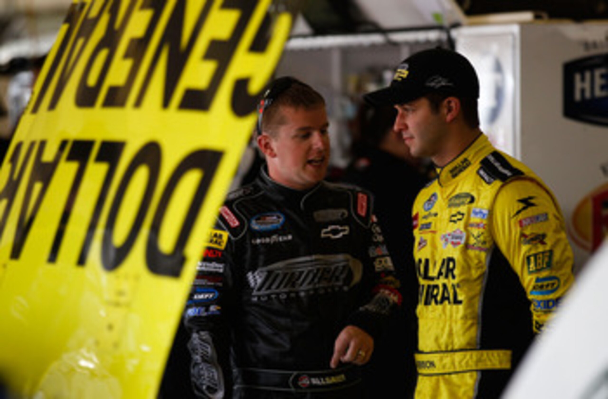 FORT WORTH, TX - APRIL 07:  Reed Sorenson, driver of the #32 Dollar General Chevrolet, and Justin Allgaier, driver of the #31 Turner Motorsports Chevrolet, converse in the garage during practice for the NASCAR Nationwide Series O'Reilly Auto Parts 300 at 
