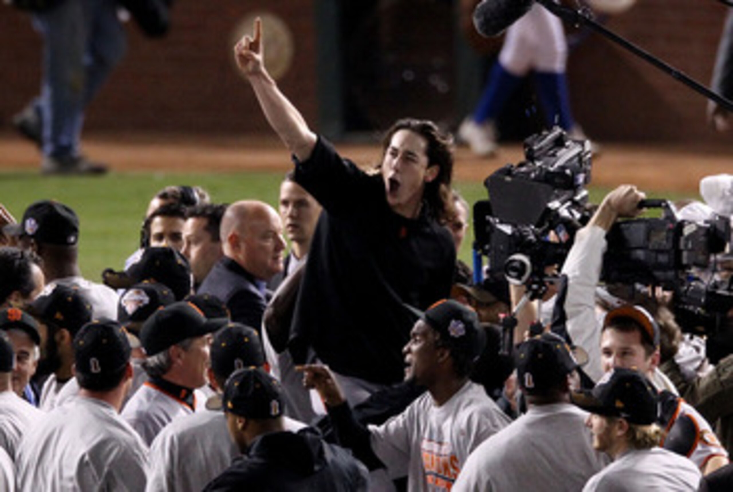 ARLINGTON, TX - NOVEMBER 01:  Pitcher Tim Lincecum #55 of the San Francisco Giants and teammates celebrate defeating the Texas Rangers 3-1 to win the 2010 MLB World Series at Rangers Ballpark in Arlington on November 1, 2010 in Arlington, Texas.  (Photo b