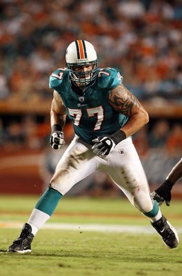 MIAMI - SEPTEMBER 21:  Offensive tackle Jake Long #77 of the Miami Dolphins drops back into pass blocking against the Indianapolis Colts at Land Shark Stadium on September 21, 2009 in Miami, Florida. The Colts defeated the Dolphins 27-23.  (Photo by Doug