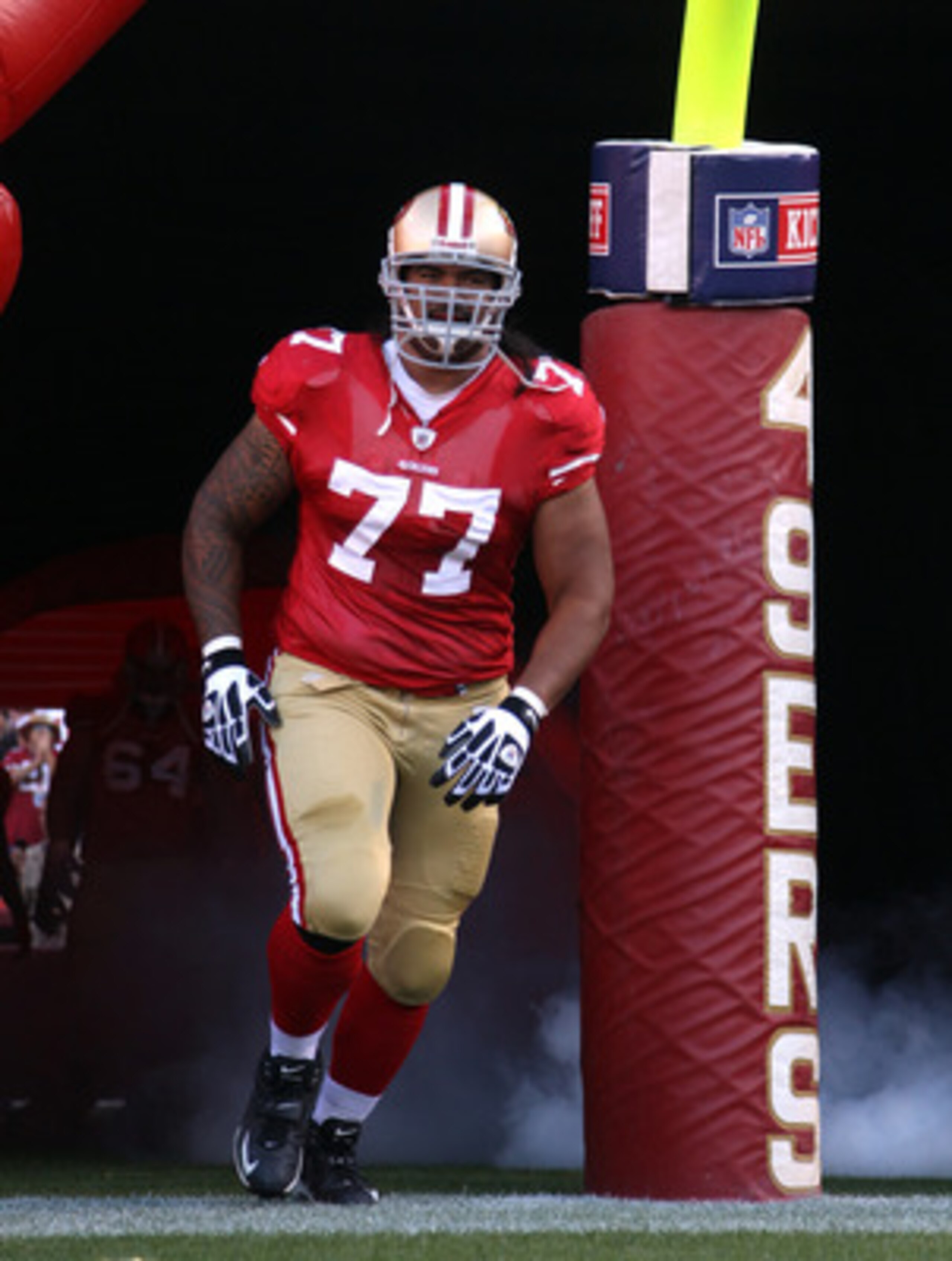 SAN FRANCISCO - SEPTEMBER 20:  Mike Iupati #77 of the San Francisco 49ers runs on to the field for their game against the New Orleans Saints at Candlestick Park on September 20, 2010 in San Francisco, California.  (Photo by Ezra Shaw/Getty Images)