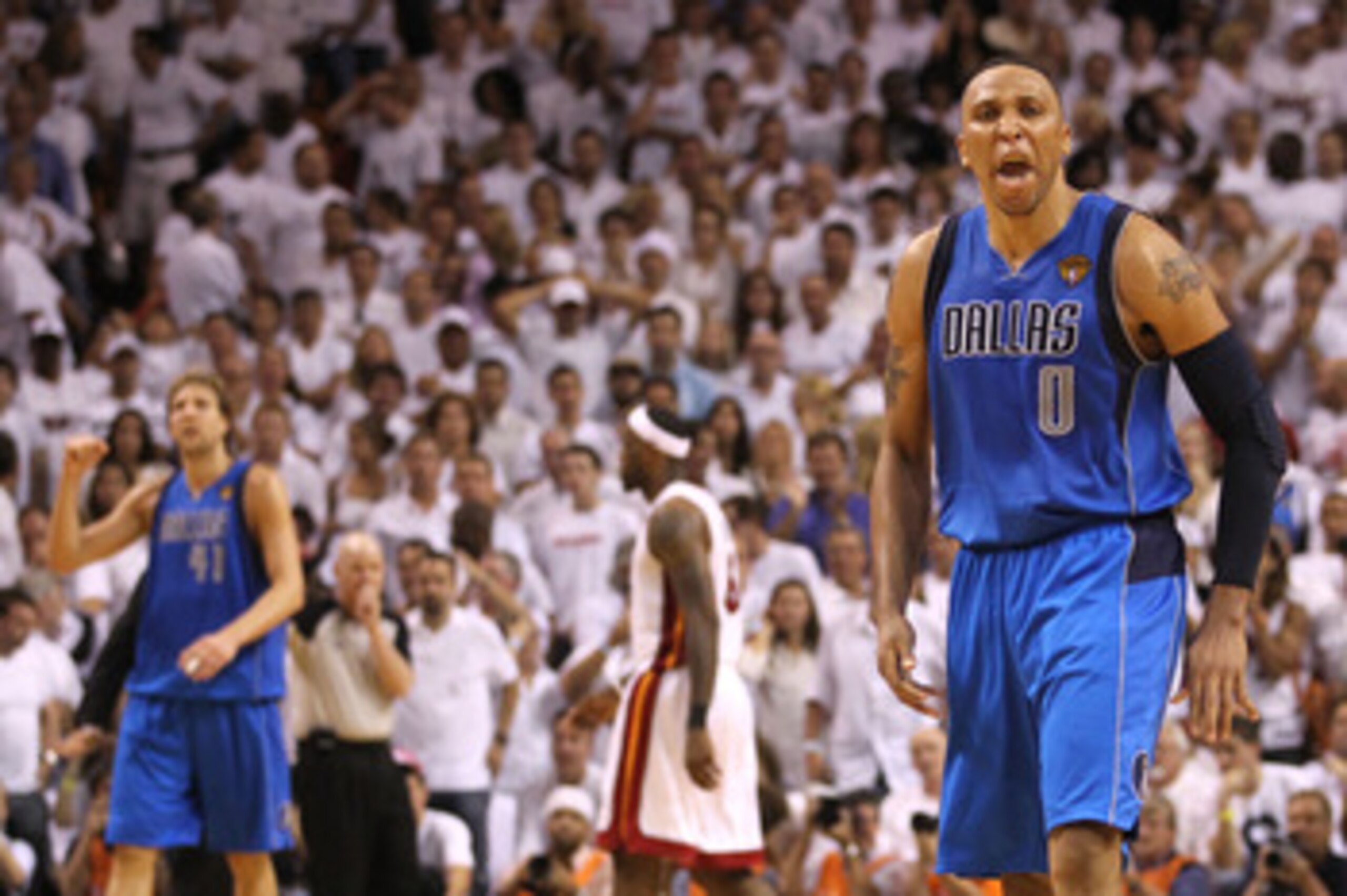 MIAMI, FL - JUNE 02:  Shawn Marion #0 (R) and Dirk Nowitzki #41 (L) of the Dallas Mavericks celebrate as LeBron James #6 of the Miami Heat walks towards the bench in Game Two of the 2011 NBA Finals at American Airlines Arena on June 2, 2011 in Miami, Flor