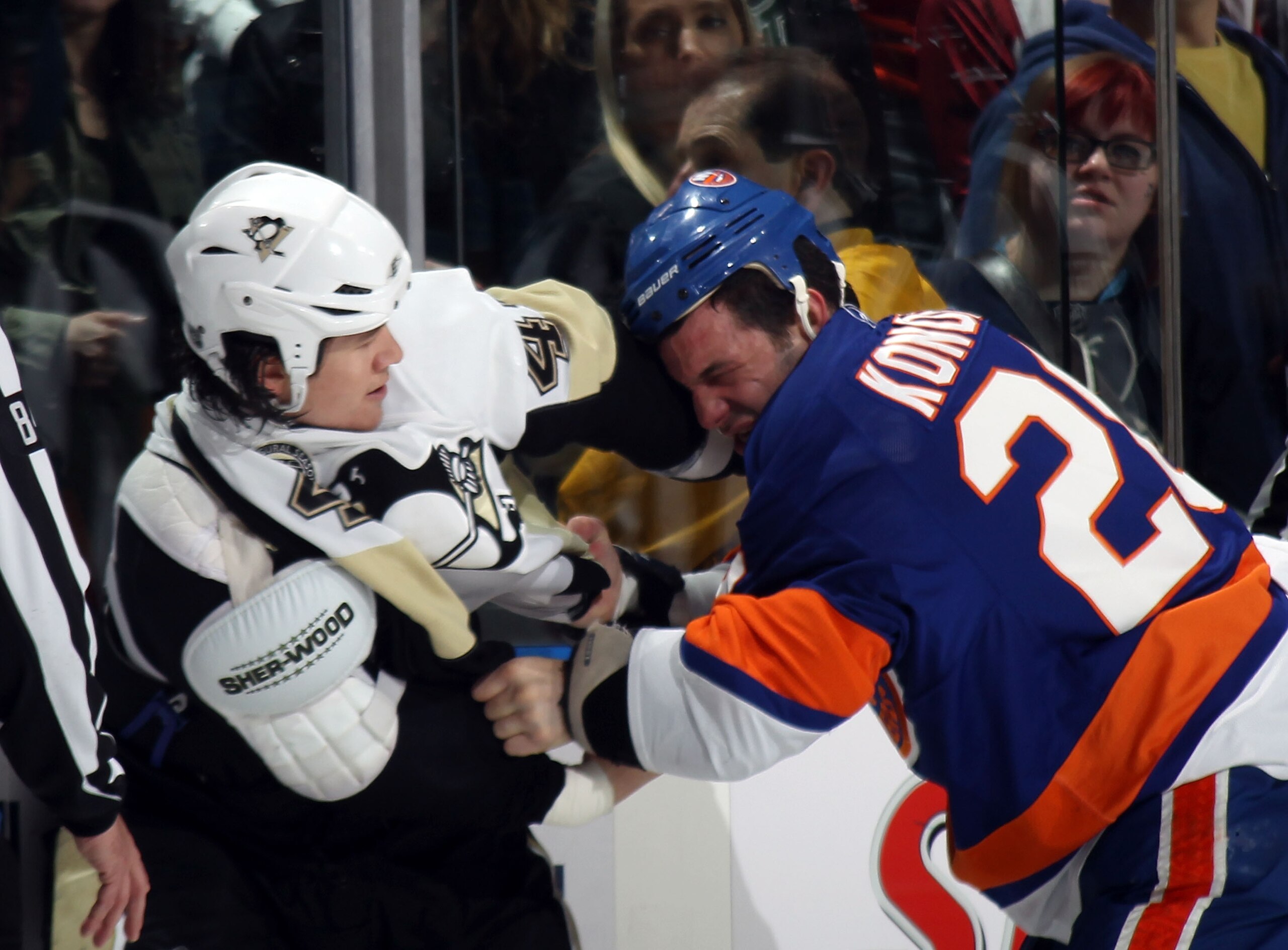 UNIONDALE, NY - APRIL 08:  Arron Asham #45 of the Pittsburgh Penguins fights with Zenon Konopka #28 of the New York Islanders in the first period at the Nassau Coliseum on April 8, 2011 in Uniondale, New York.  (Photo by Bruce Bennett/Getty Images)